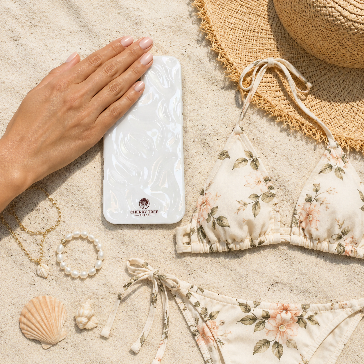 Pearl-white case beachside luxury flat lay.png