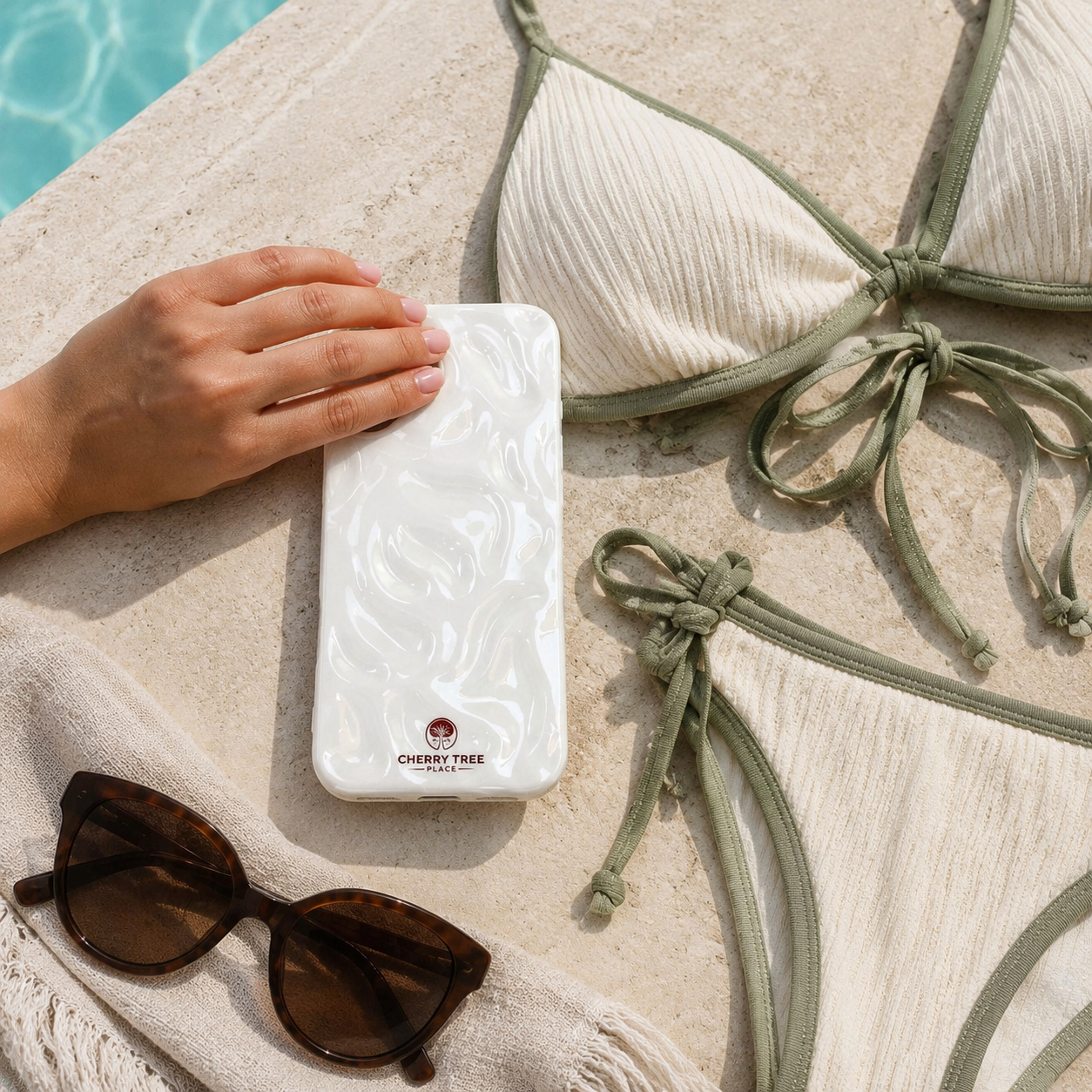 Pearl-White Phone Case Poolside Flat Lay.png
