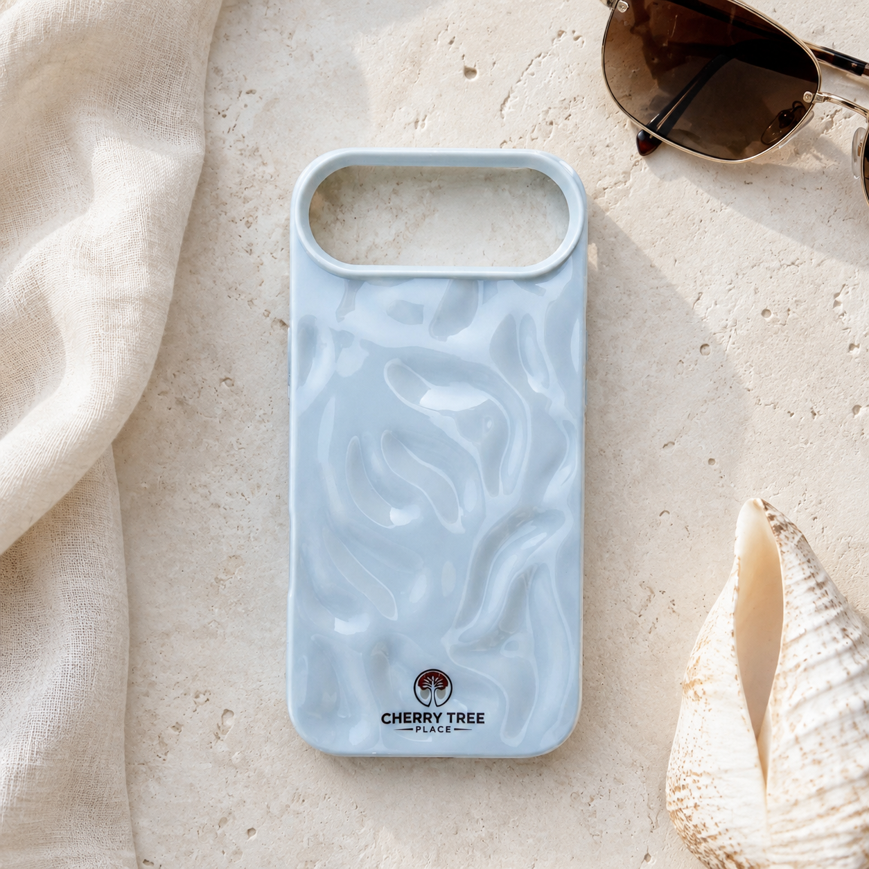 Pale blue pearlescent case flat lay.png