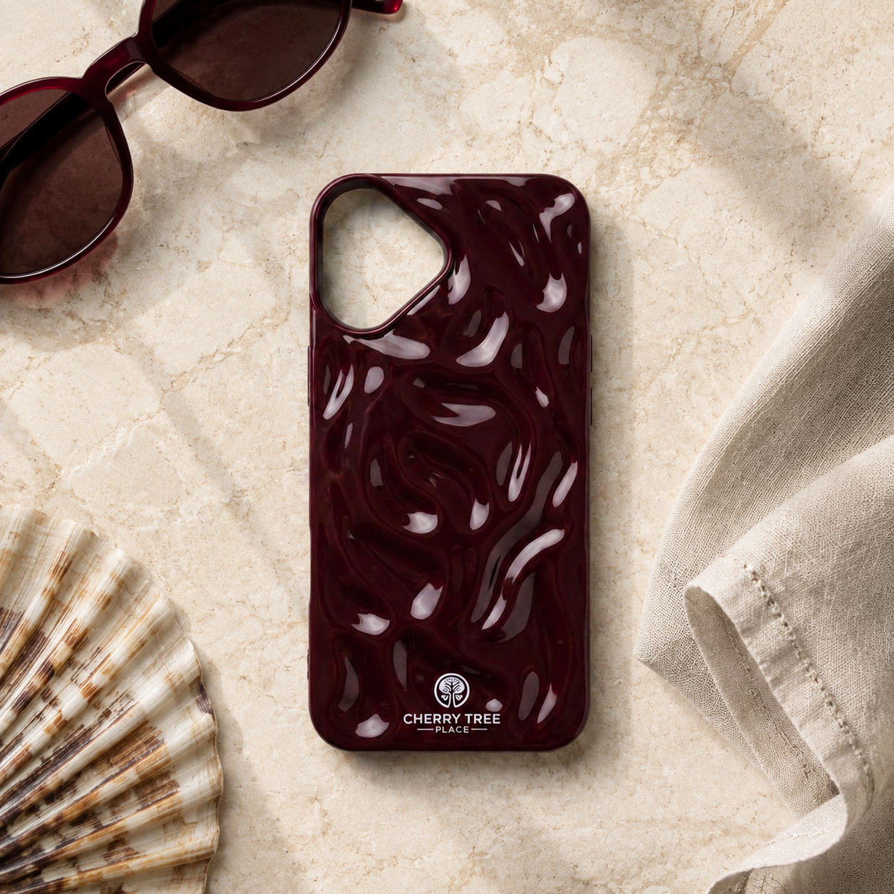 Burgundy Ripple Phone Case Flat Lay.png