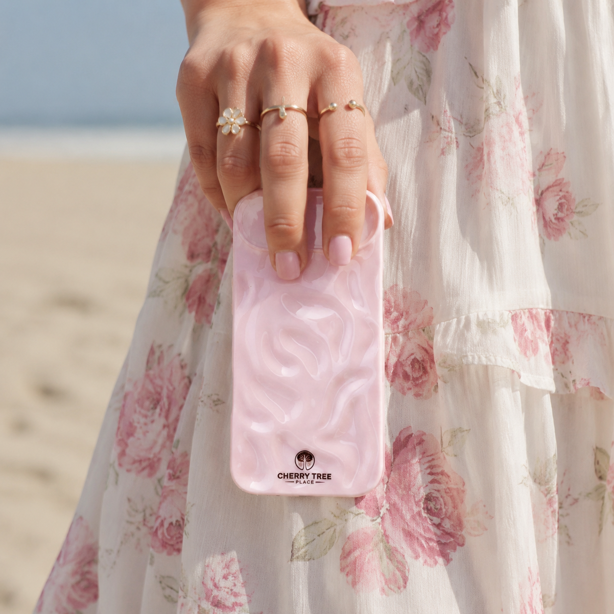 Blush-Pink Case Beside Floral Dress.png