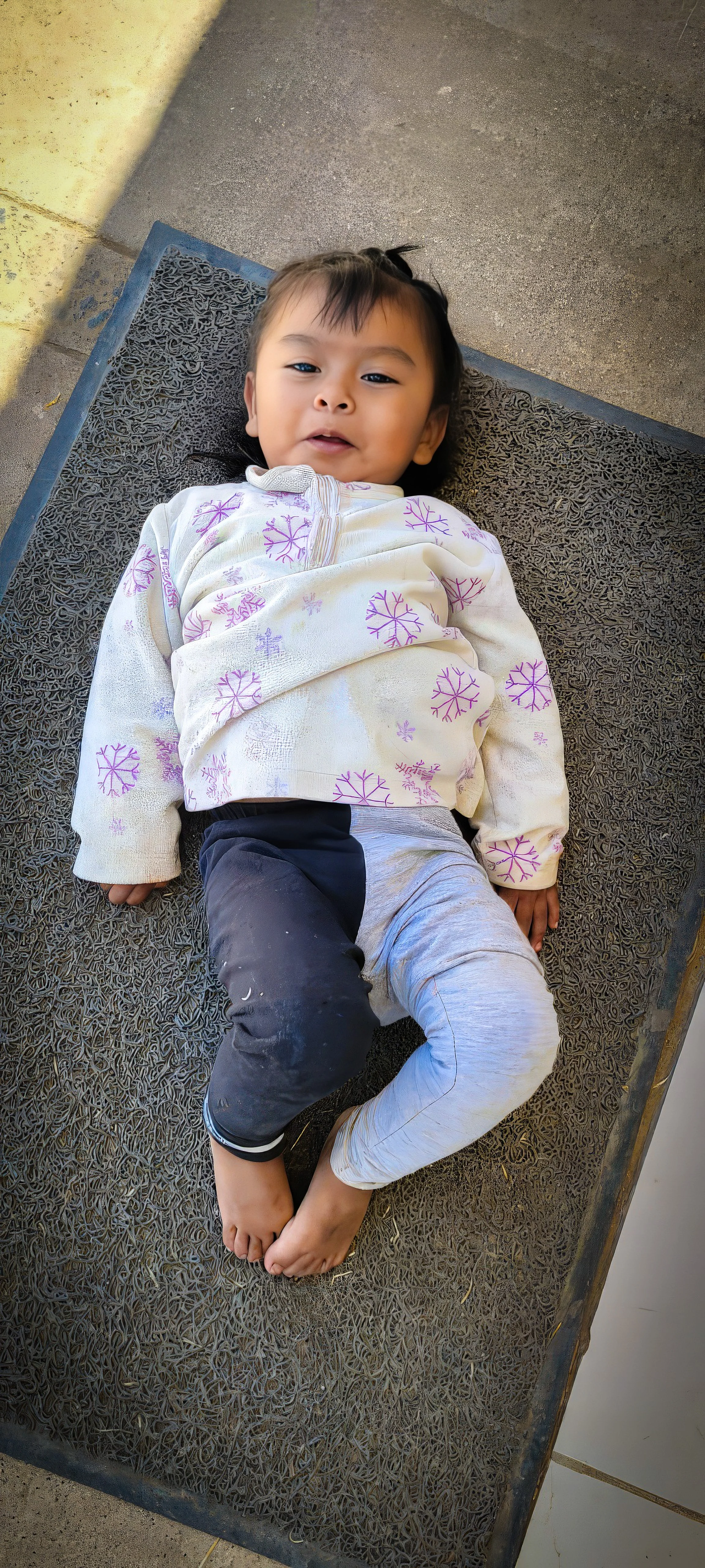 a young girl smiles