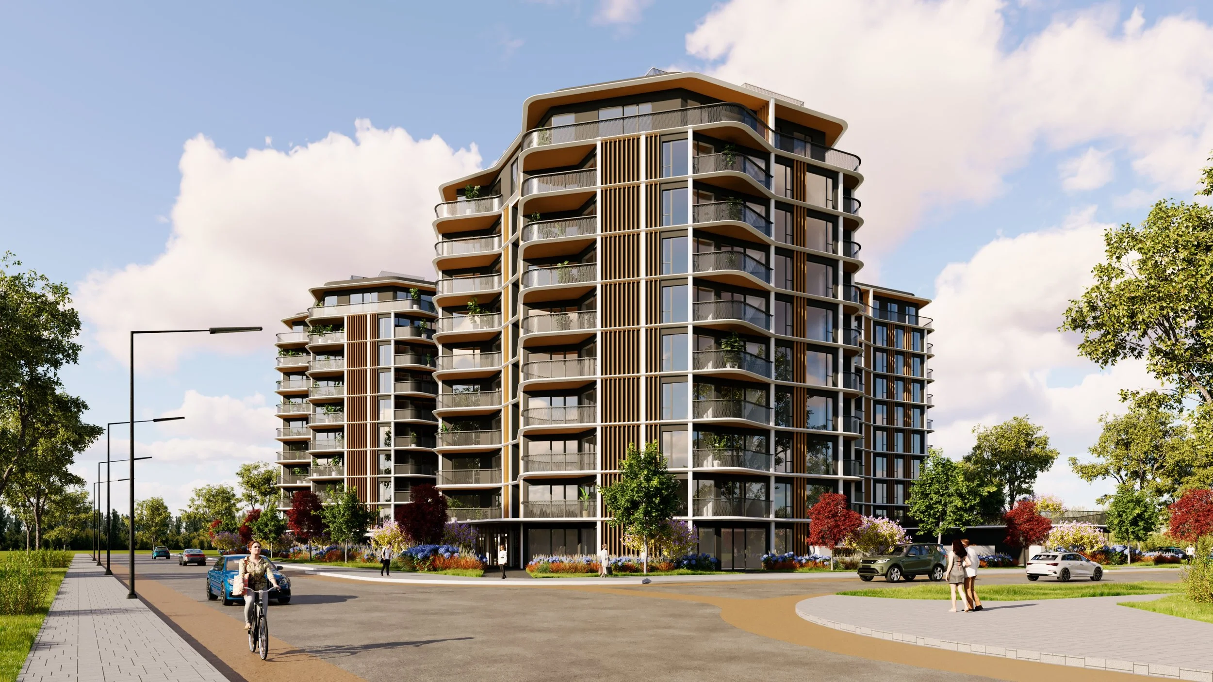 Modern multi-story residential building with curved balconies and glass windows, surrounded by trees, cars, pedestrians, and a bike rider on a sunny day.