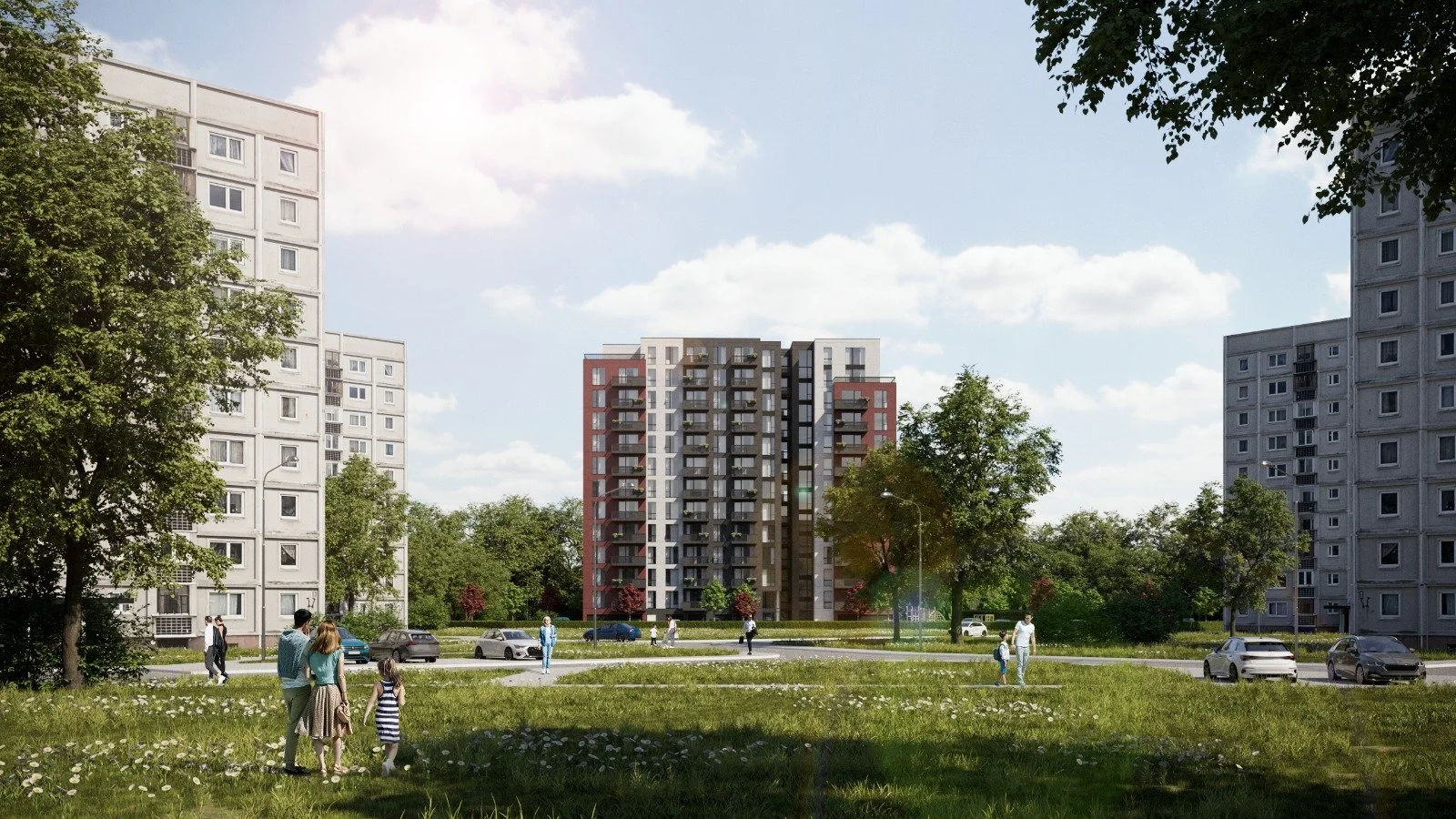 A group of people, including children, walking through a grassy park area with trees, surrounded by tall residential apartment buildings on a sunny day with scattered clouds.