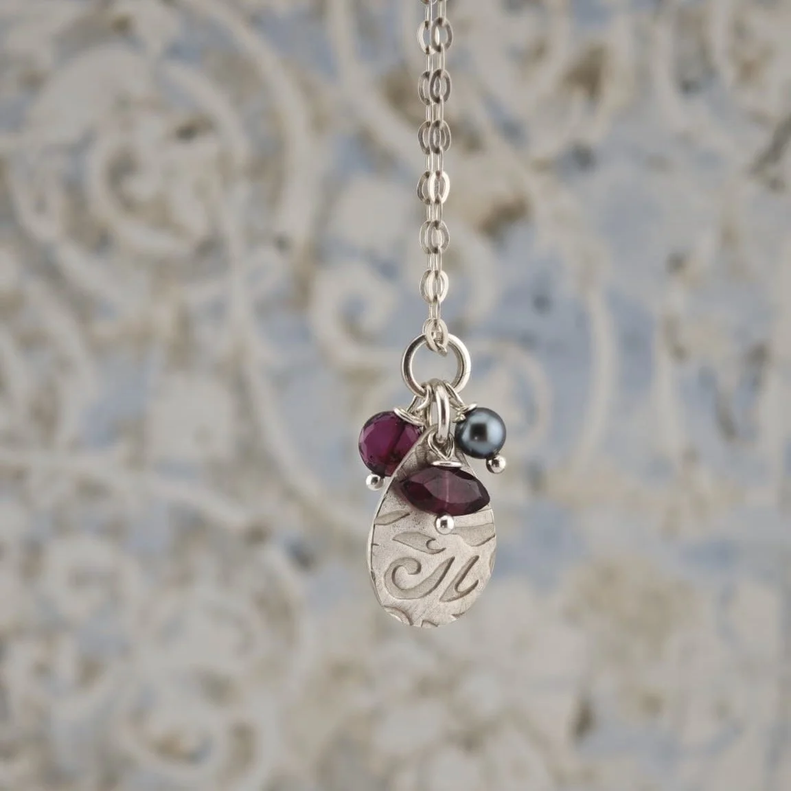 Silver Teardrop Patterned Pendant with Garnets & a Black Pearl