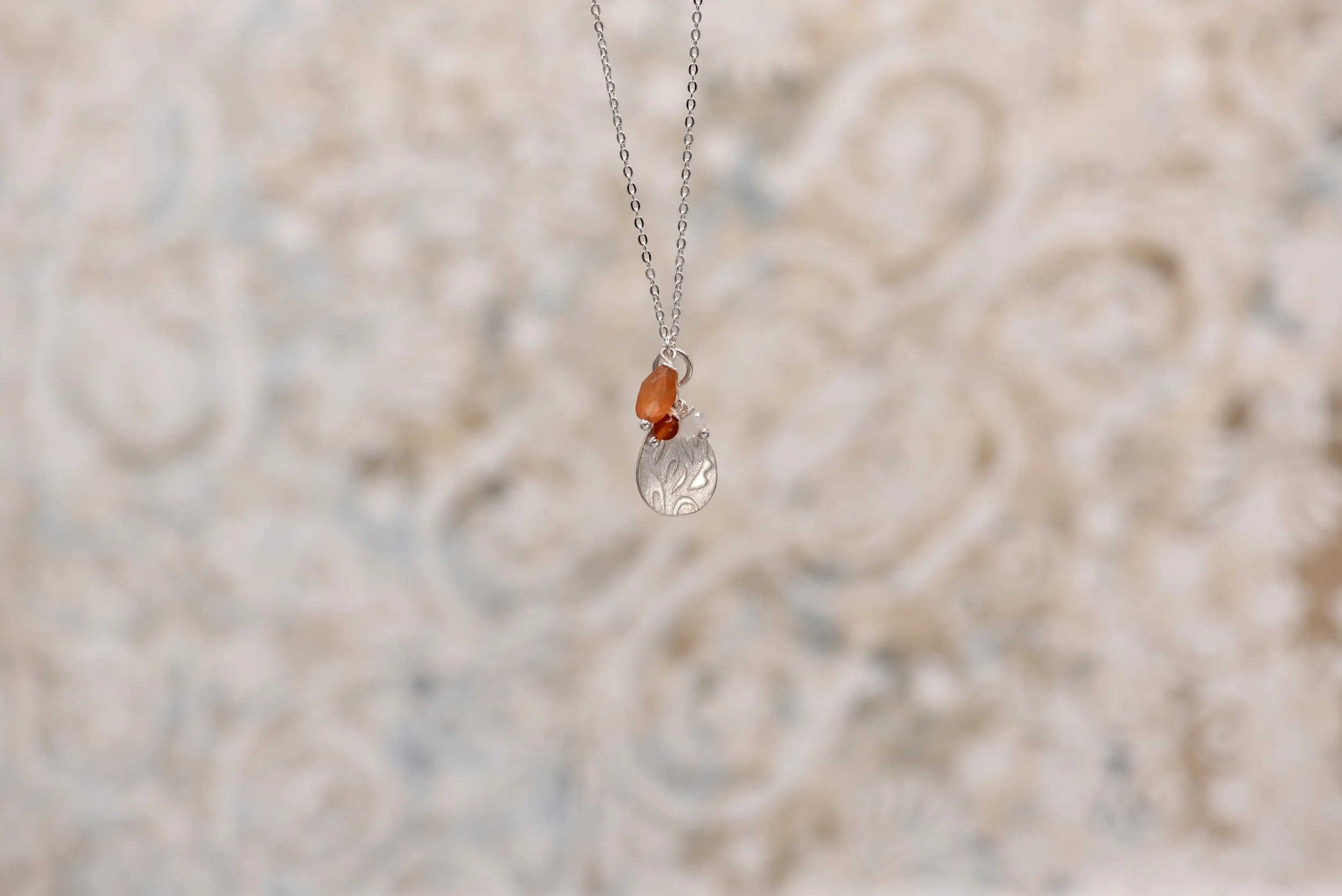 sally-de-lasteyrie-jewellery-orange-beads-silver-necklace-min.jpeg