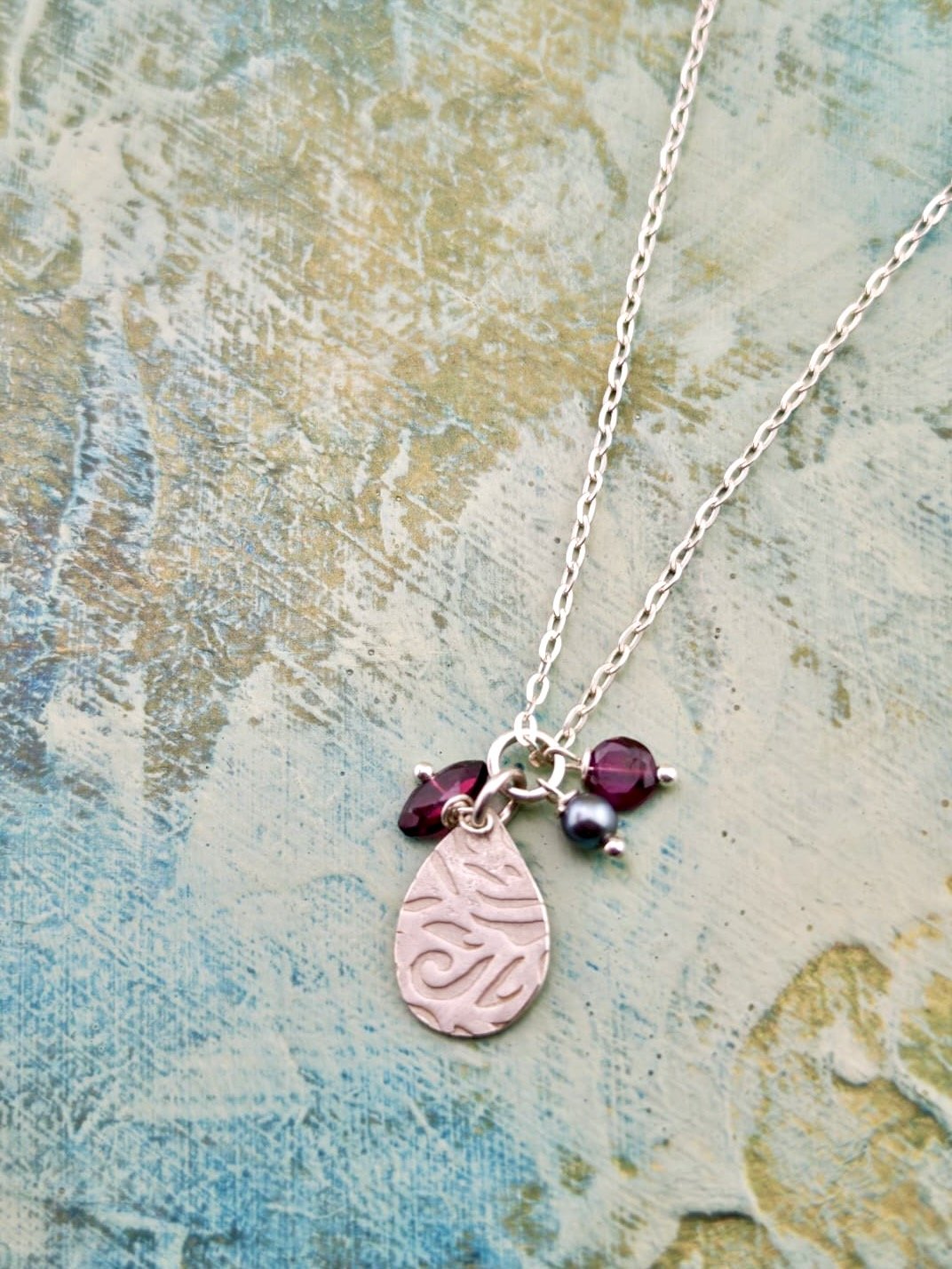Silver roll printed Pendant with Garnets & Black Pearl