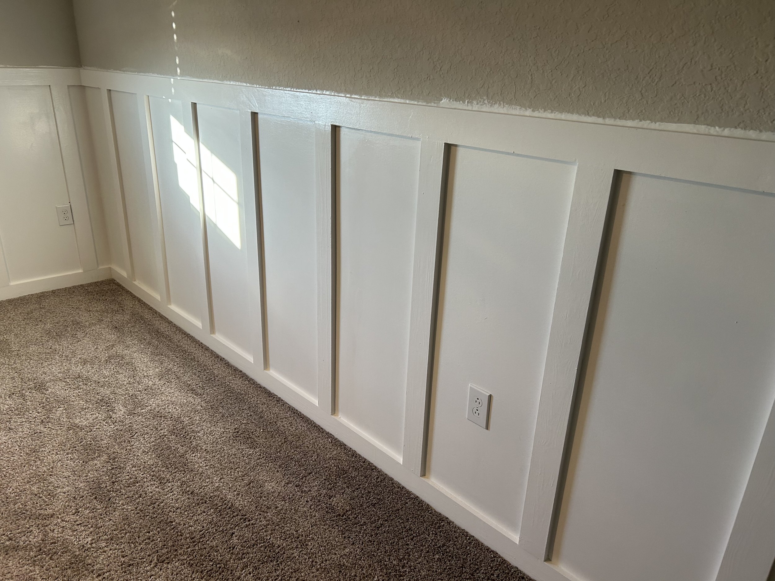 board and batten wall in upstairs living room