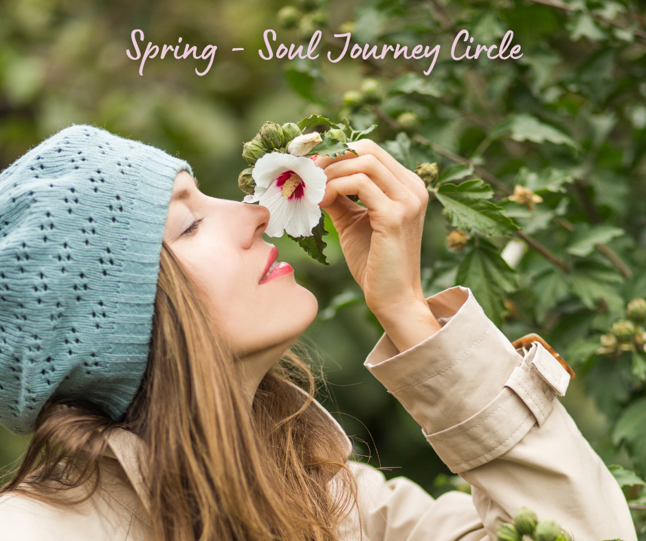 woman smelling flower in the spring