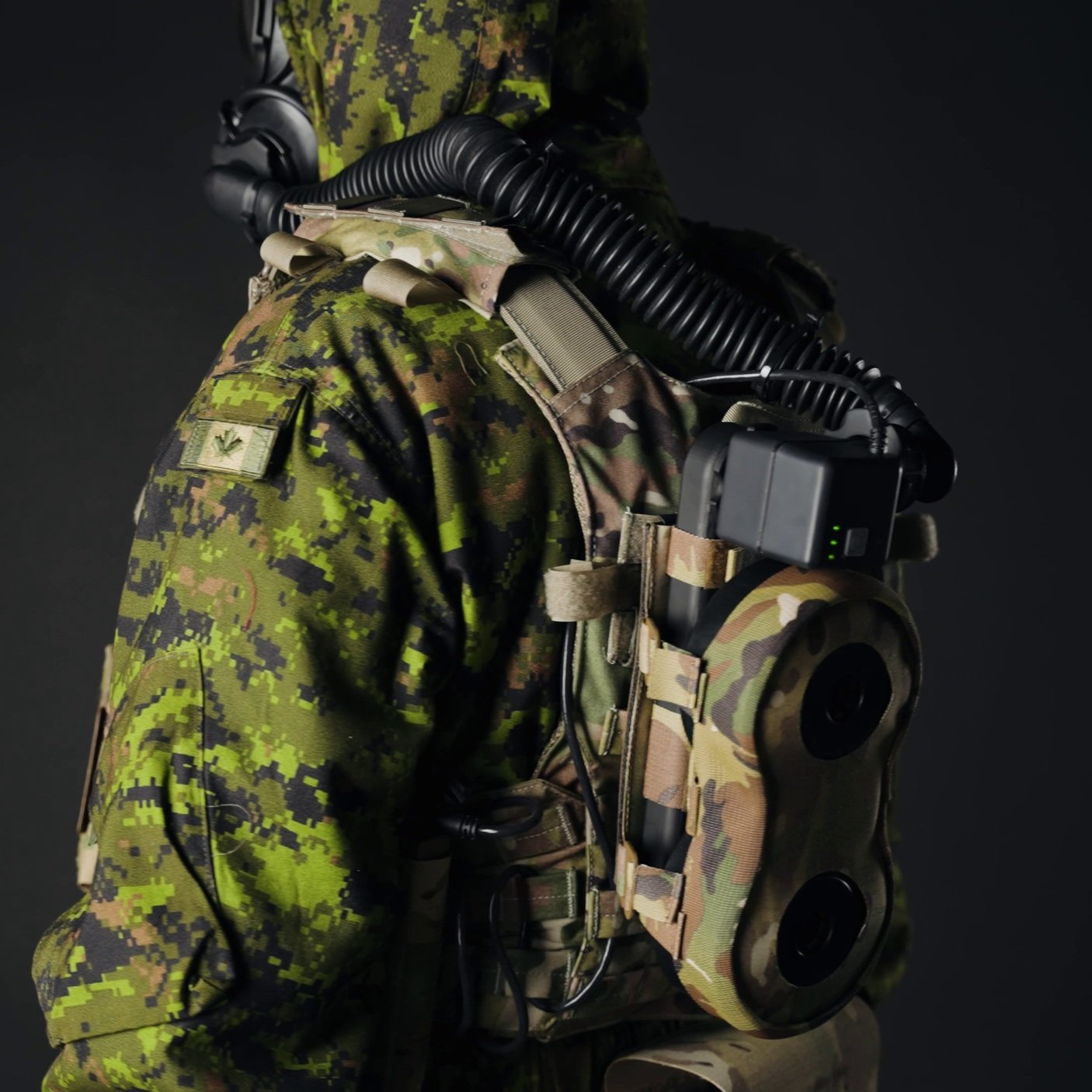 Side view of CD-PAPR with Dual-Filter Manifold on User in CBRN suit