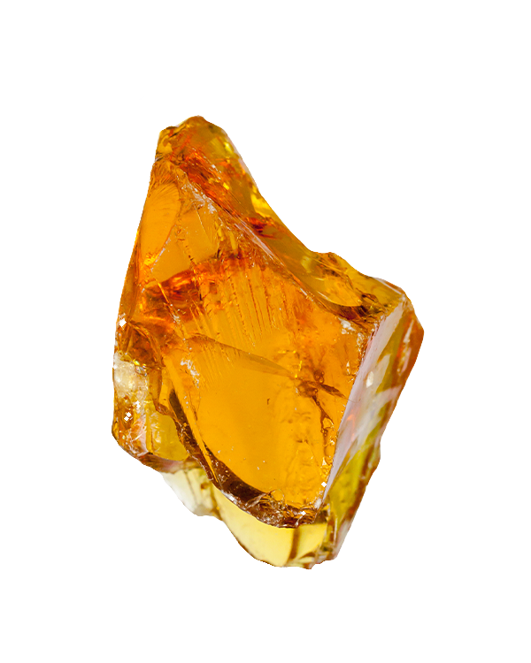 A large chunk of transparent amber-colored gemstone or resin with irregular shape and smooth, shiny surface.