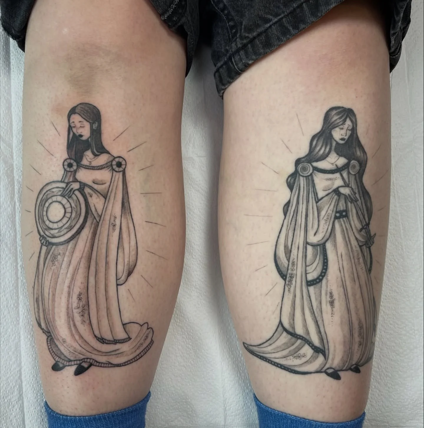 some flash done by @nimimatattoo in the studio! she was inspired by a fantasy book from goodwill for these and i for one am a huge fan! we love a duo shin piece 🧚🏻&zwj;♂️🧚🏻&zwj;♀️🧚🏻