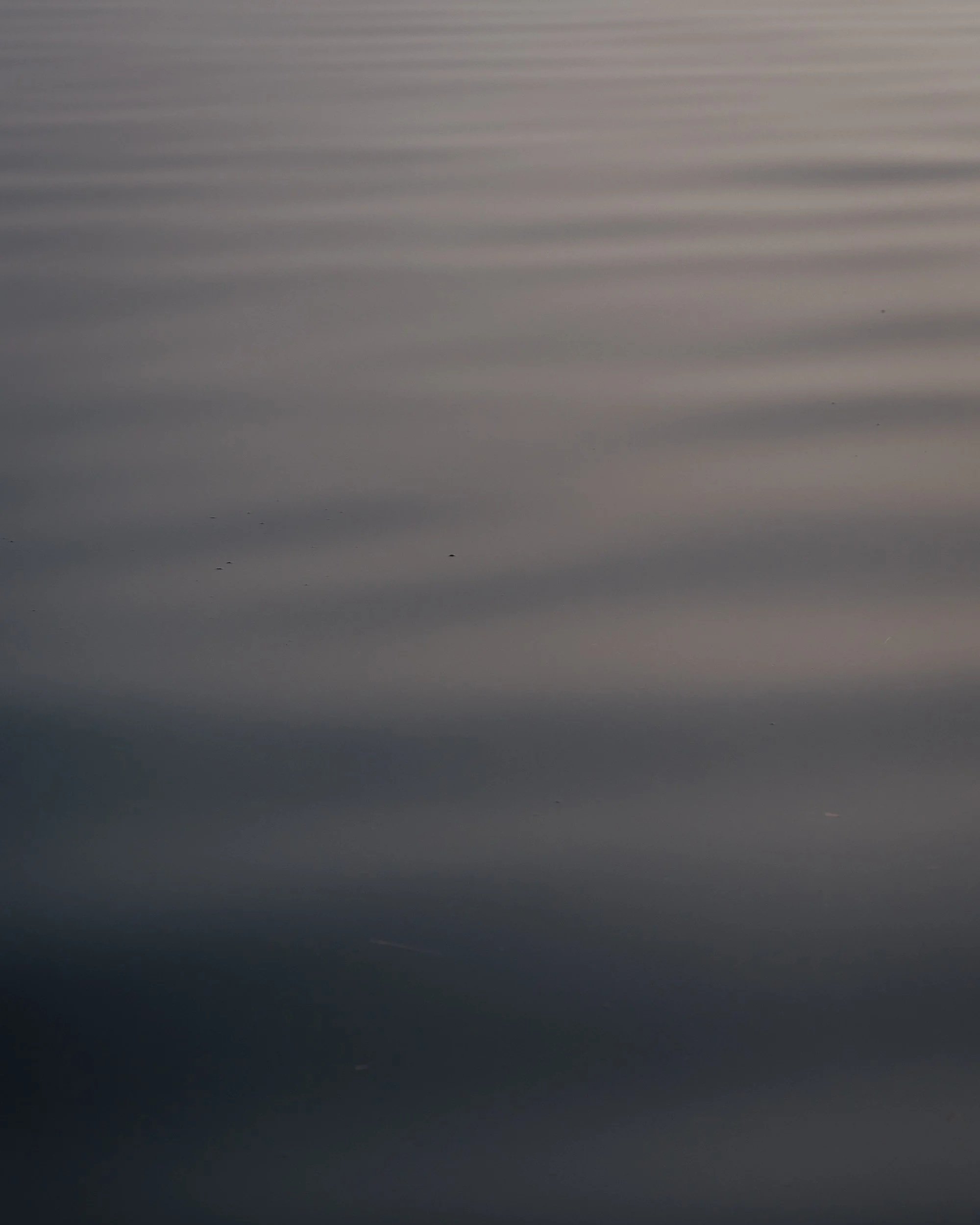 Close-up of a metallic surface with horizontal ridges.