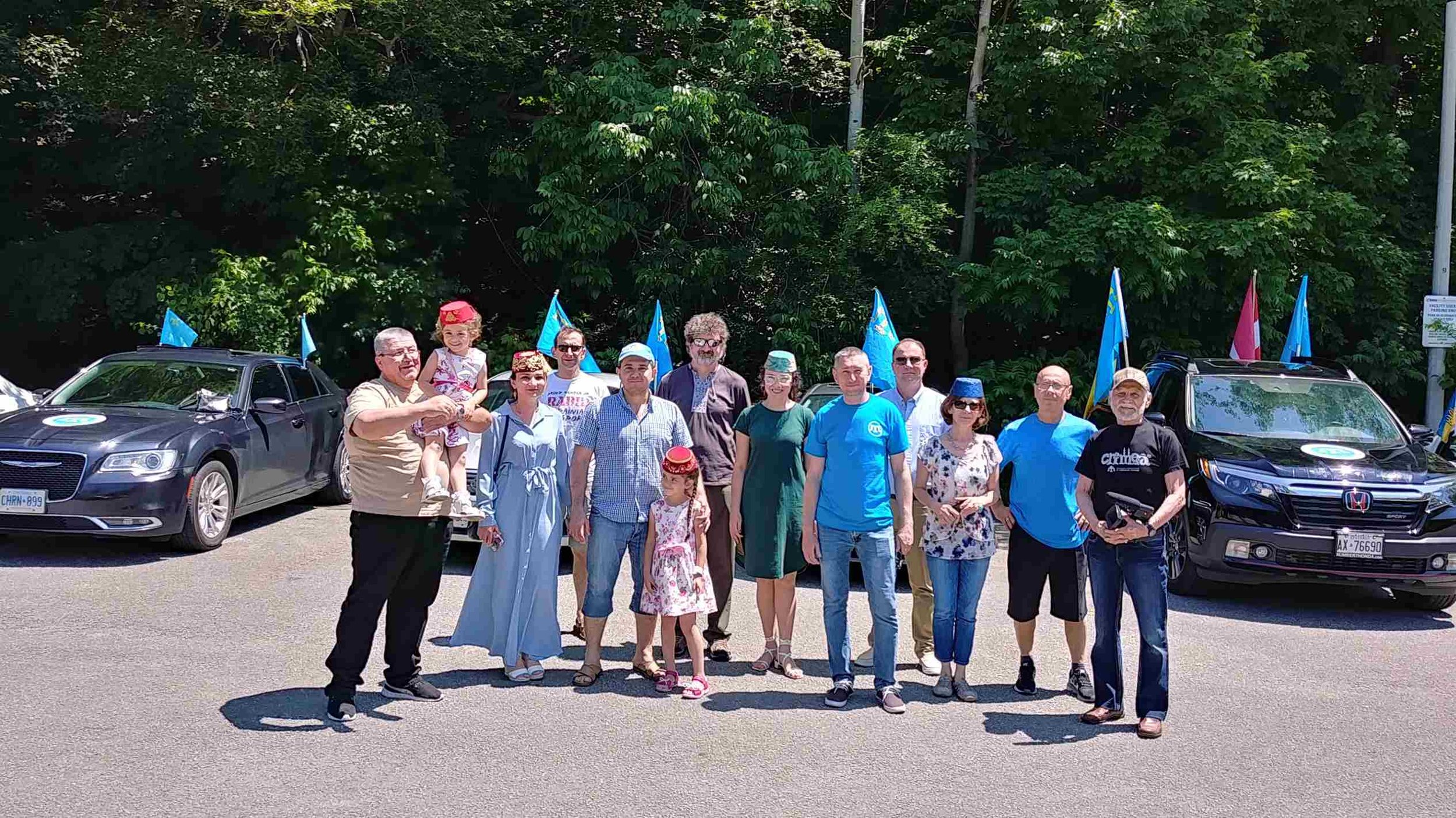 Group photo of rally participants — uniting generations to celebrate cultural identity.