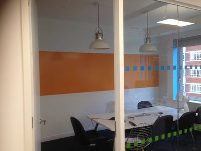 A painted whiteboard dry erase board area created in a London office with green paint