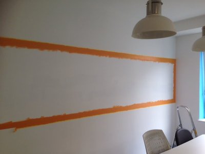 Painting & Creating a whiteboard dry erase board area in a London office with orange paint