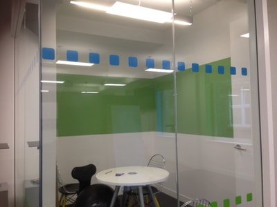 A painted whiteboard dry erase board area created in an office with green paint