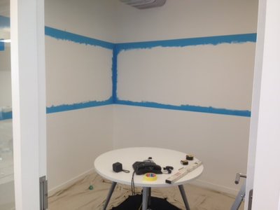 A painted whiteboard dry erase board area created in a London office with blue paint