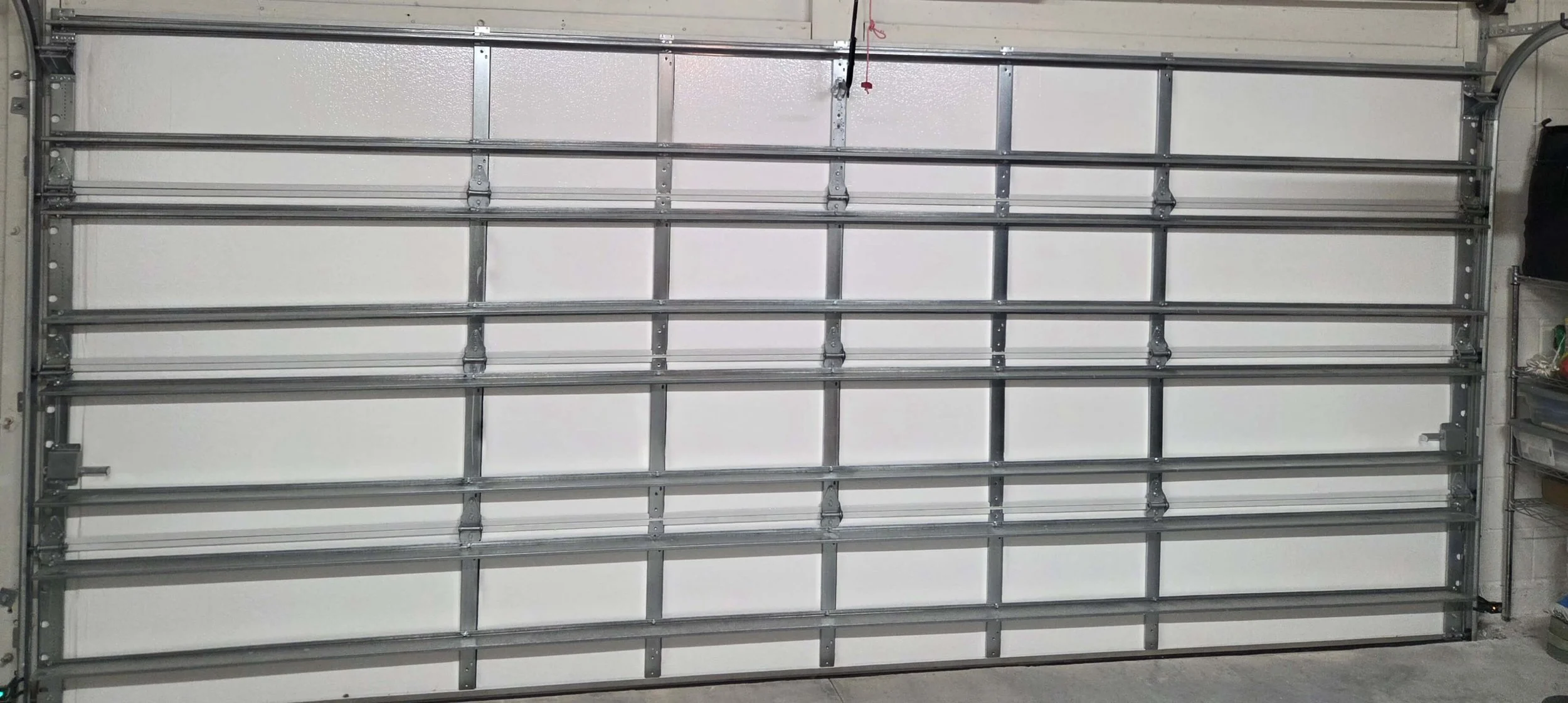 Garage door insulation installation on residential garage to improve energy efficiency in Brevard County Florida