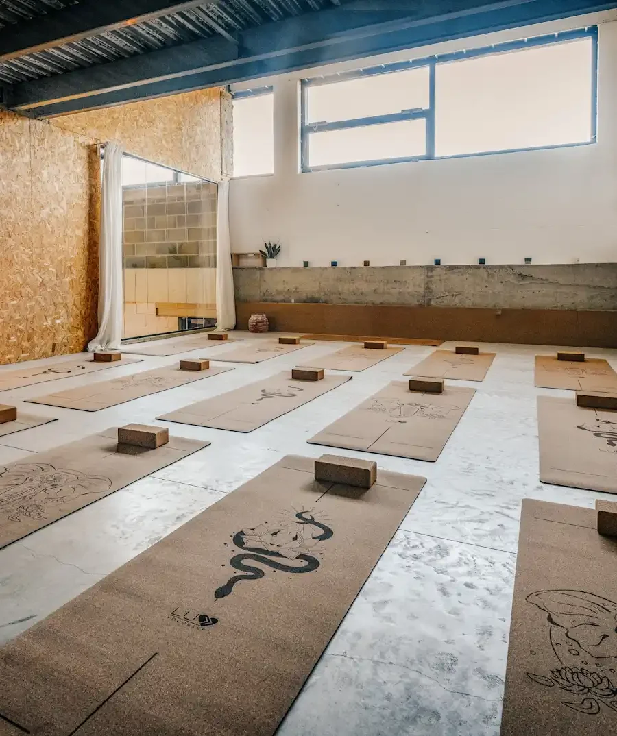 cork yoga mats ready for a class at our Industrial Vibe space, filled with natural light and wood accents.