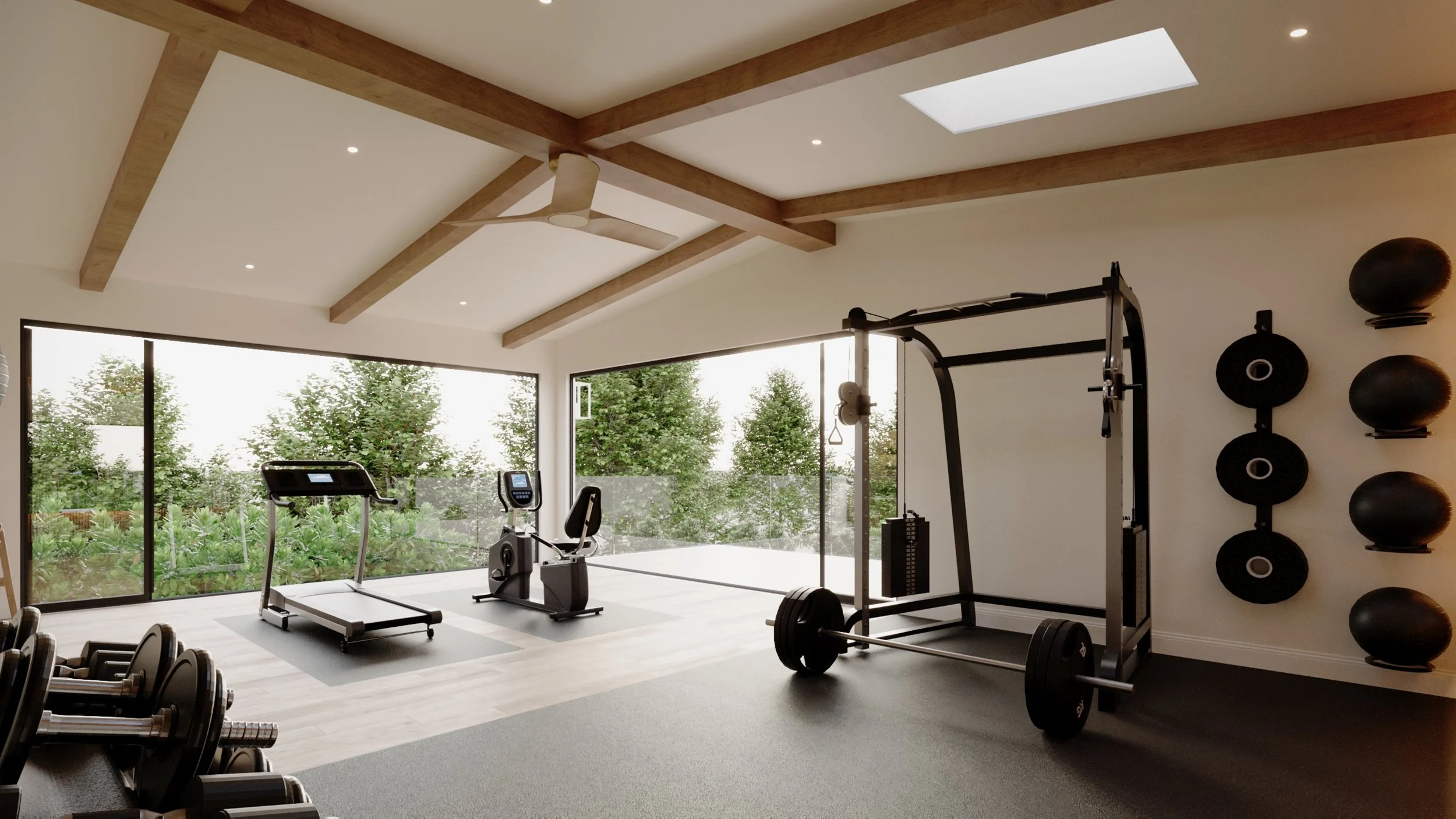 A modern gym with large windows, cardio equipment, weightlifting machines, and wall-mounted weights. Natural light streams in, and trees are visible outside.