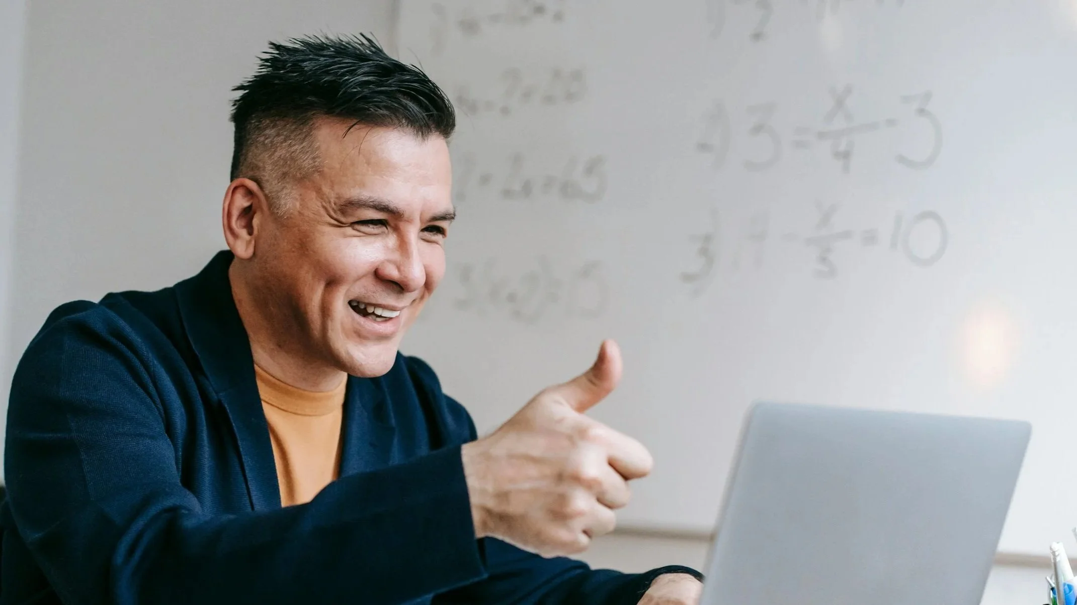 A podcaster interviews a guest who speaks into a microphone.