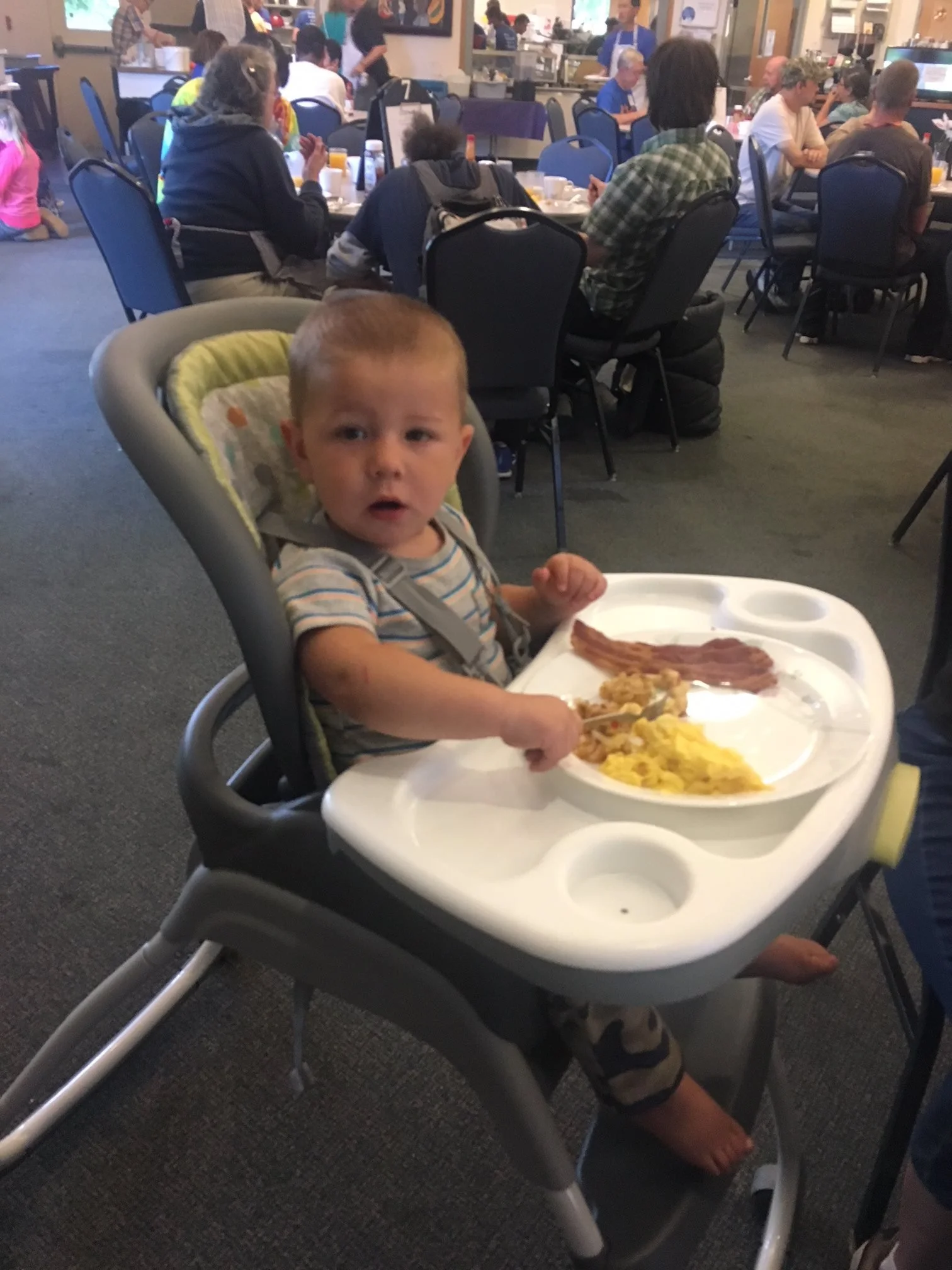 A child eating breakfast.