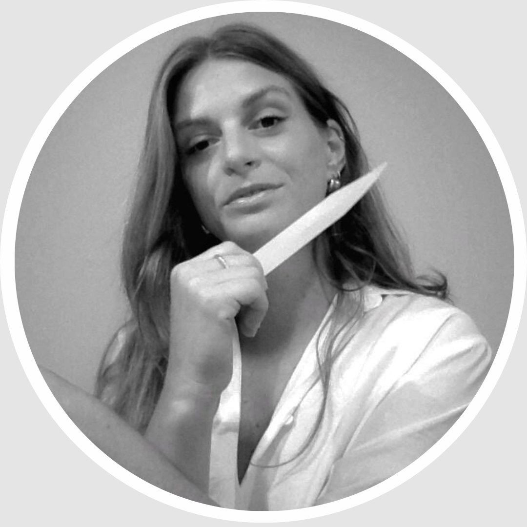Portrait of Laure Shalgian, founder of Why So Scentimental WSSC — fine fragrance consultant and creative strategist, holding a fragrance blotter.