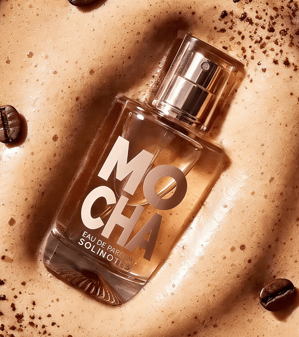 Mocha by Solinotes – perfume bottle on latte foam, in a glass filled with vanilla pods, whipped cream and chocolate, and on a plate with coffee beans and a mocha mug, Coffee Break trend by WSSC