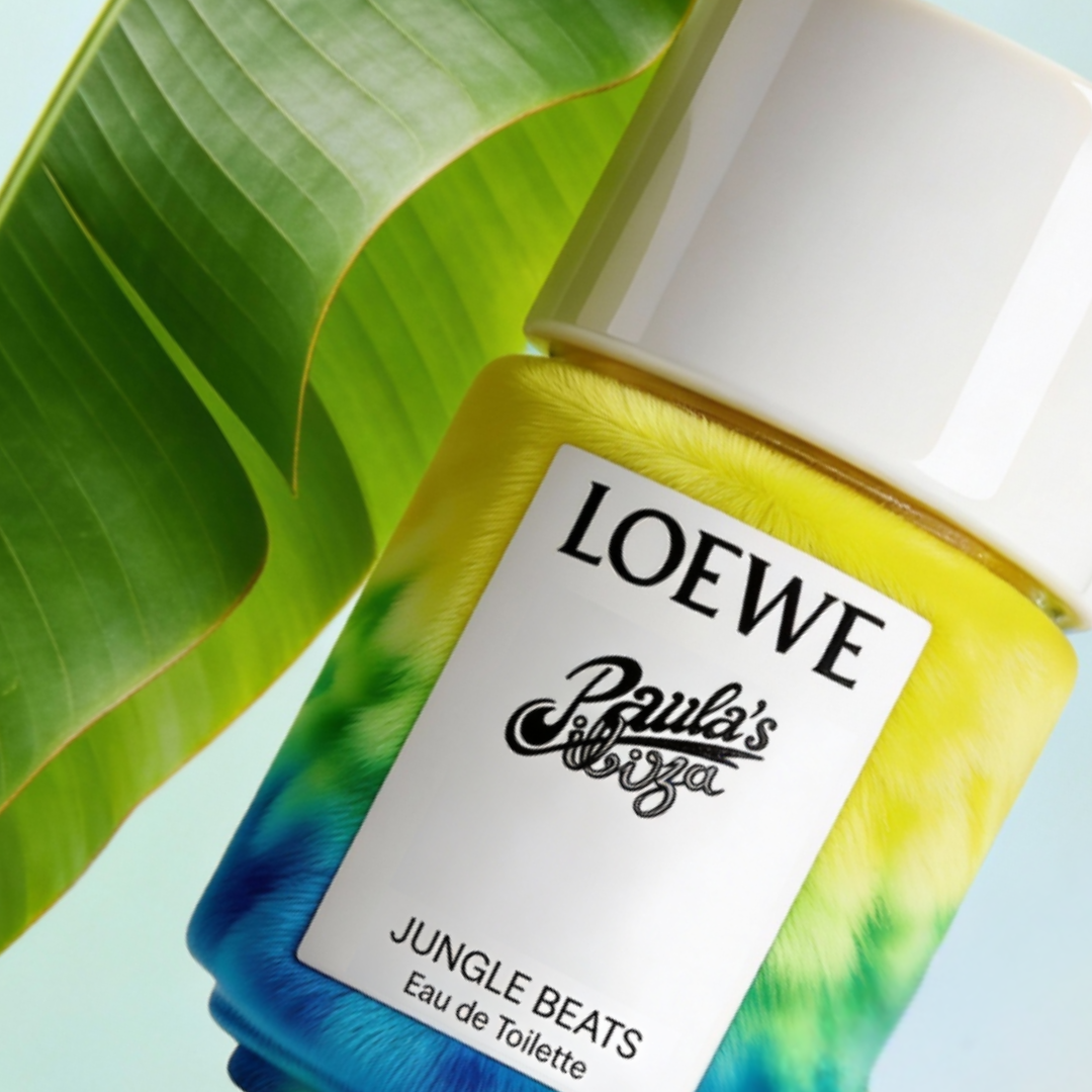 Paula's Ibiza Jungle Beats by Loewe – Eau de Toilette for Women, gradient tie and dye furry green-yellow bottle with white cap against light blue background with tropical banana leaf, ScentLab prospective concept by WSSC