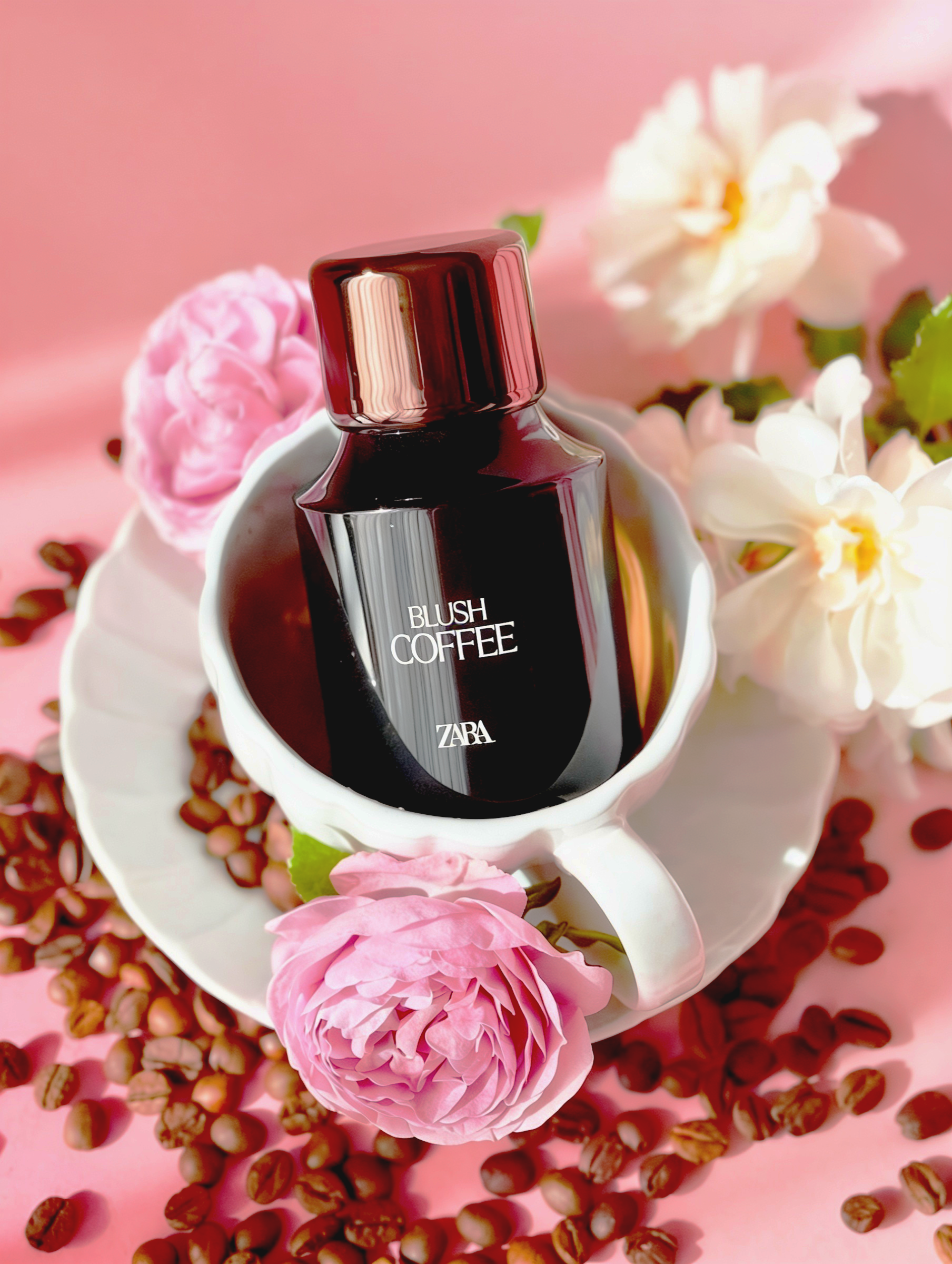 Blush Coffee by Zara – black perfume bottle in white coffee cup with pink and white flowers and coffee beans, Coffee Break trend by WSSC