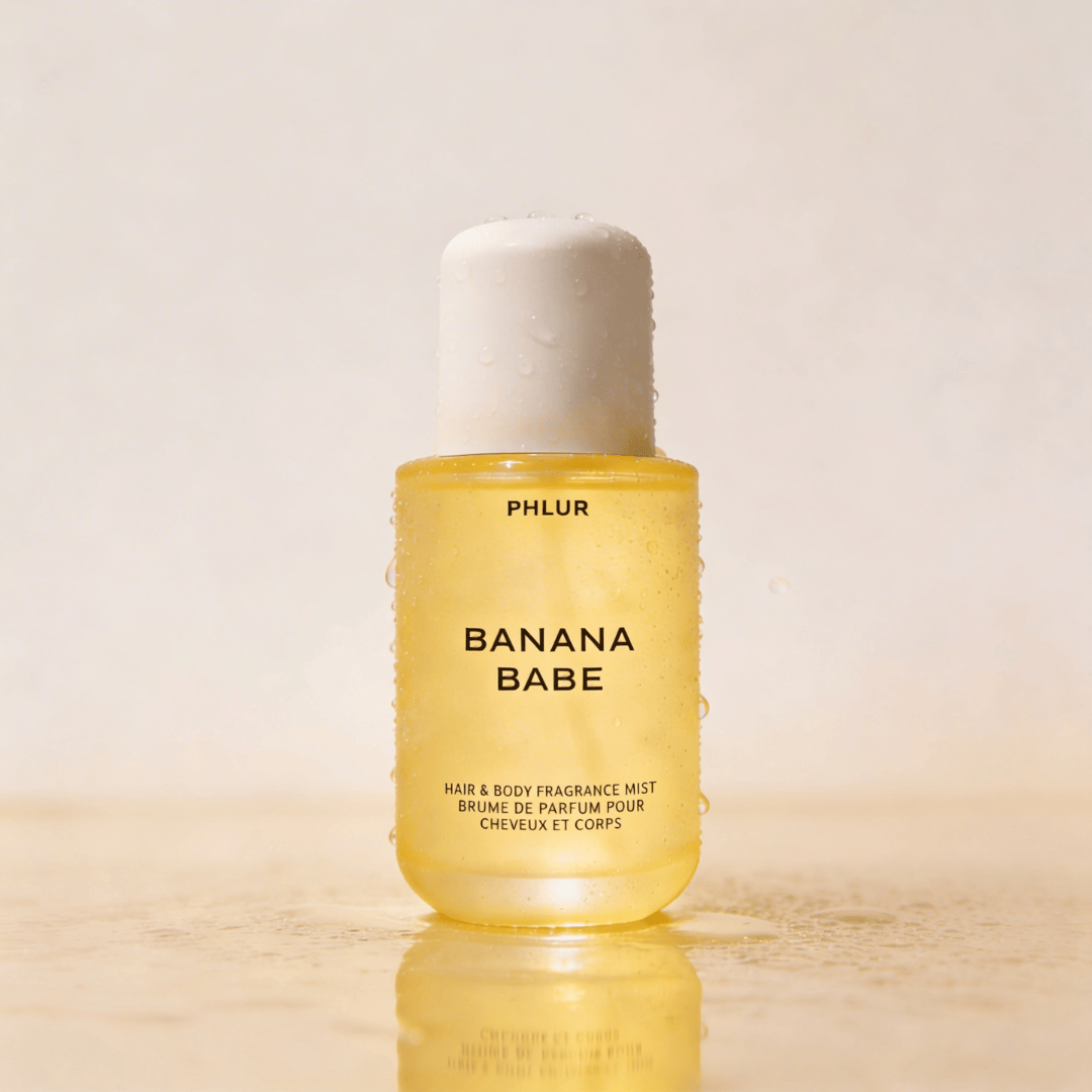 Banana Babe by Phlur – Unisex Hair and Body Fragrance Mist, translucent yellow bottle with white pump cap on neutral background, ScentLab prospective concept by WSSC