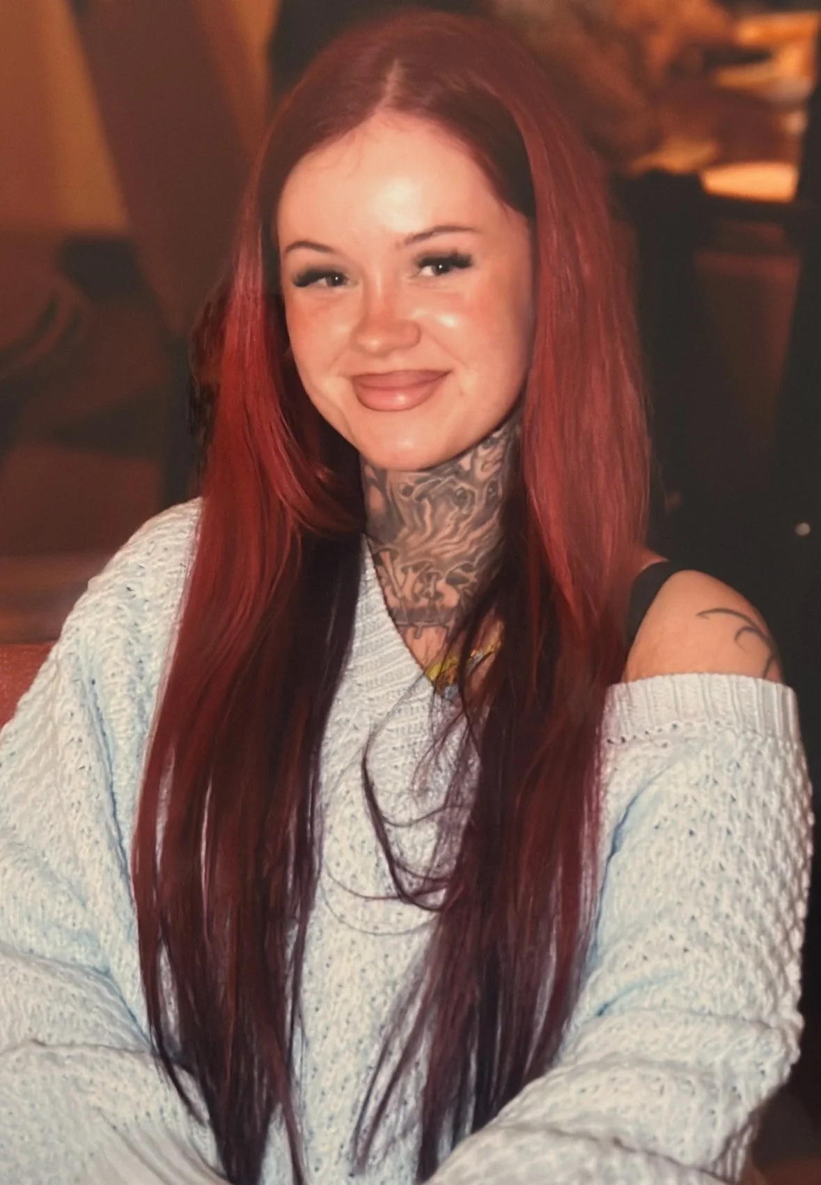 Skylar with long red hair. Skylar is an esthetician at Twelve Summers in Owasso who specializes in brows as well as facials and facial waxing.