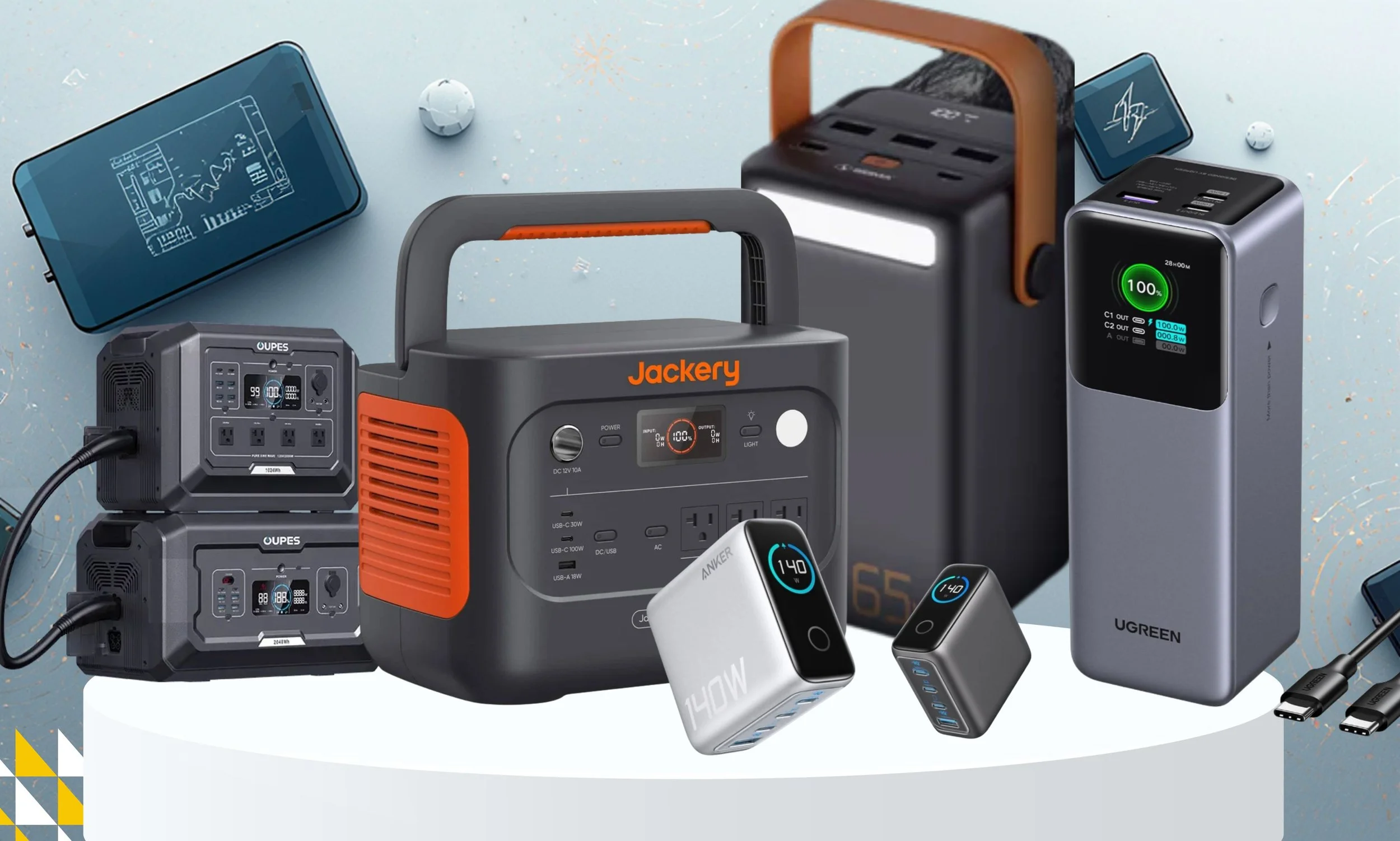 A collection of portable power banks, chargers, and batteries for electronic devices, with digital displays and power outlets displayed on a light-colored surface.