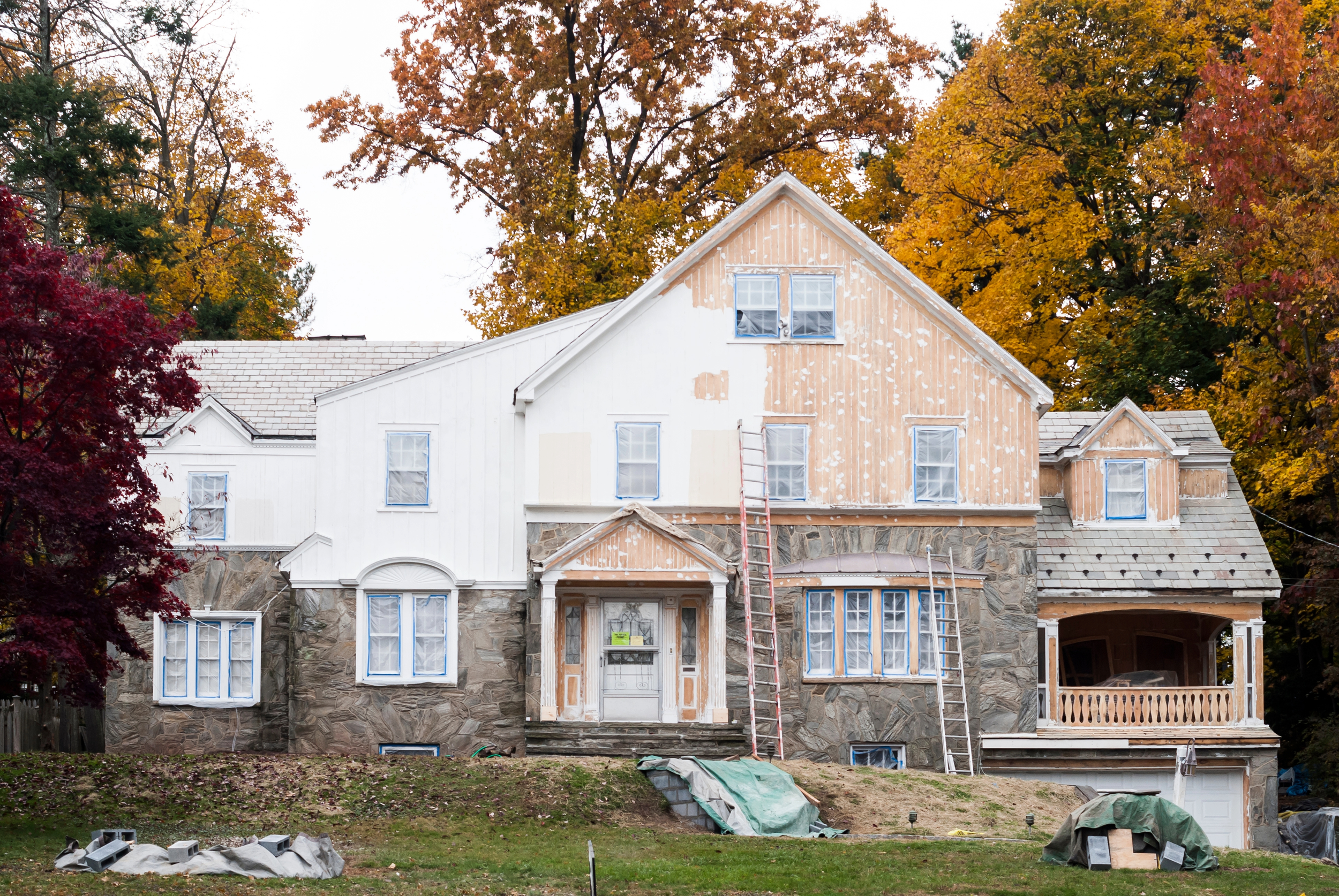 Professional Exterior Building Painting and Gutter Painting Services