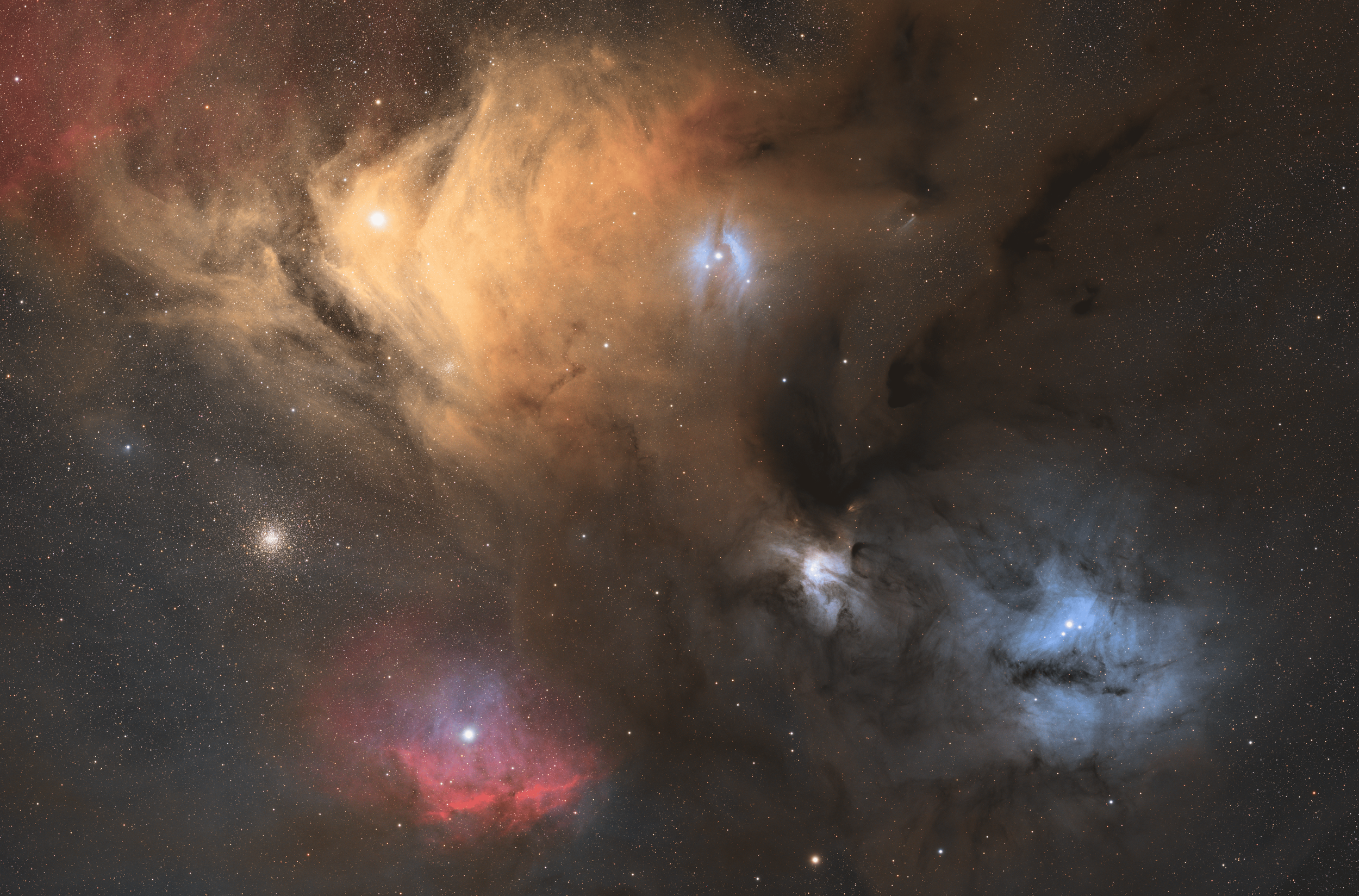 A detailed image of a colorful star-forming nebula in space, featuring bright blue, orange, and pink gas clouds, with numerous stars scattered throughout the scene.