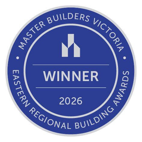 Circular badge reading 'Master Builders Victoria Easton Regional Building Awards 2026 Winner' with a stylized building logo in the center.