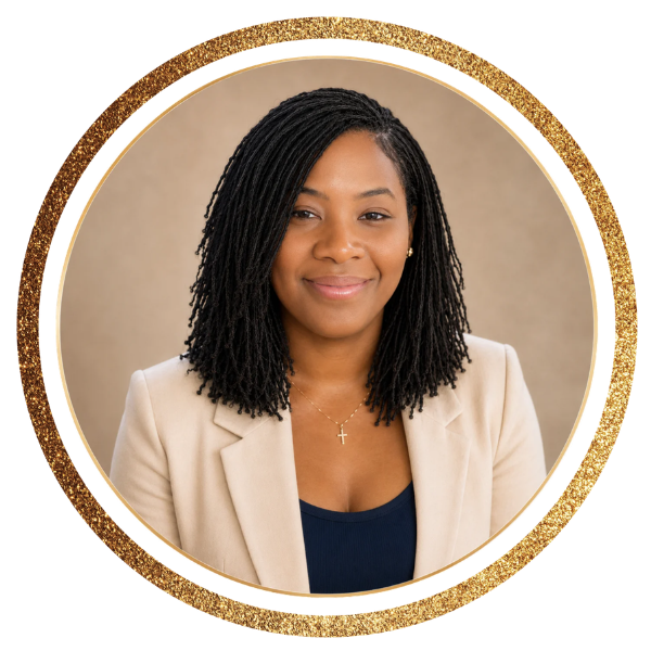 Lyci Hodges in a beige blazer and navy top, smiling in a professional portrait against a neutral background.