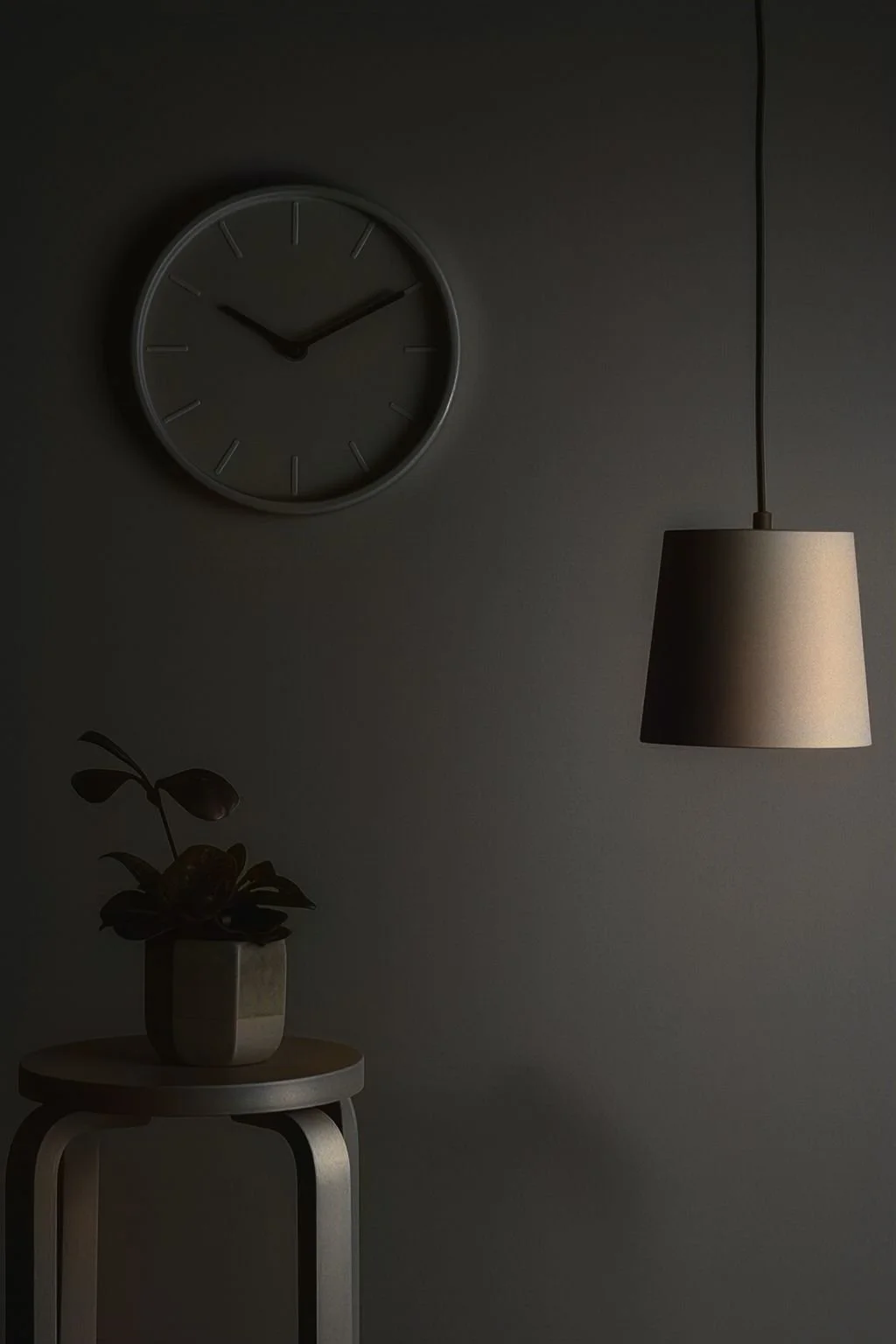 A calm evening interior scene with soft light and a clock, representing the moment when the night slows down.