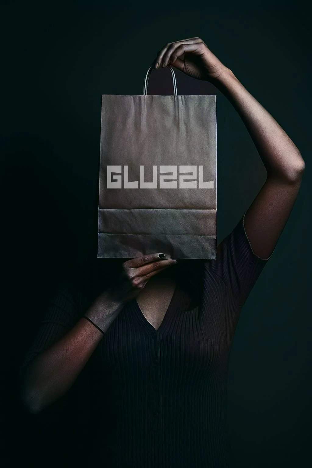 Person holding a beige shopping bag with the word 'GUEST' printed in block letters over their face, with a dark background.