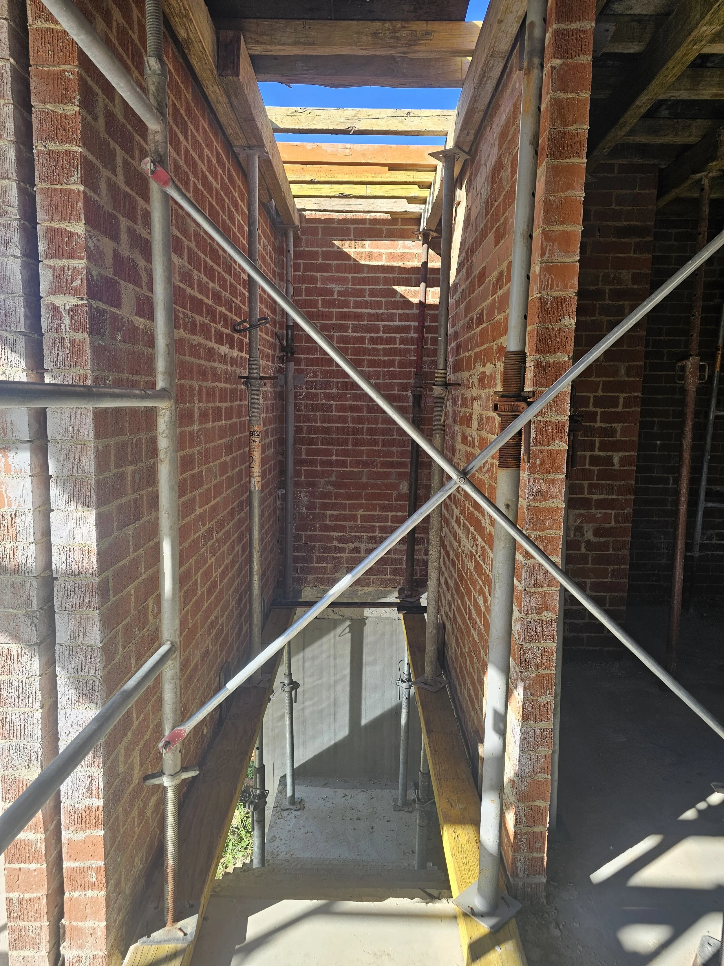 Propping to support elevated deck above stair void, 4m height clearance