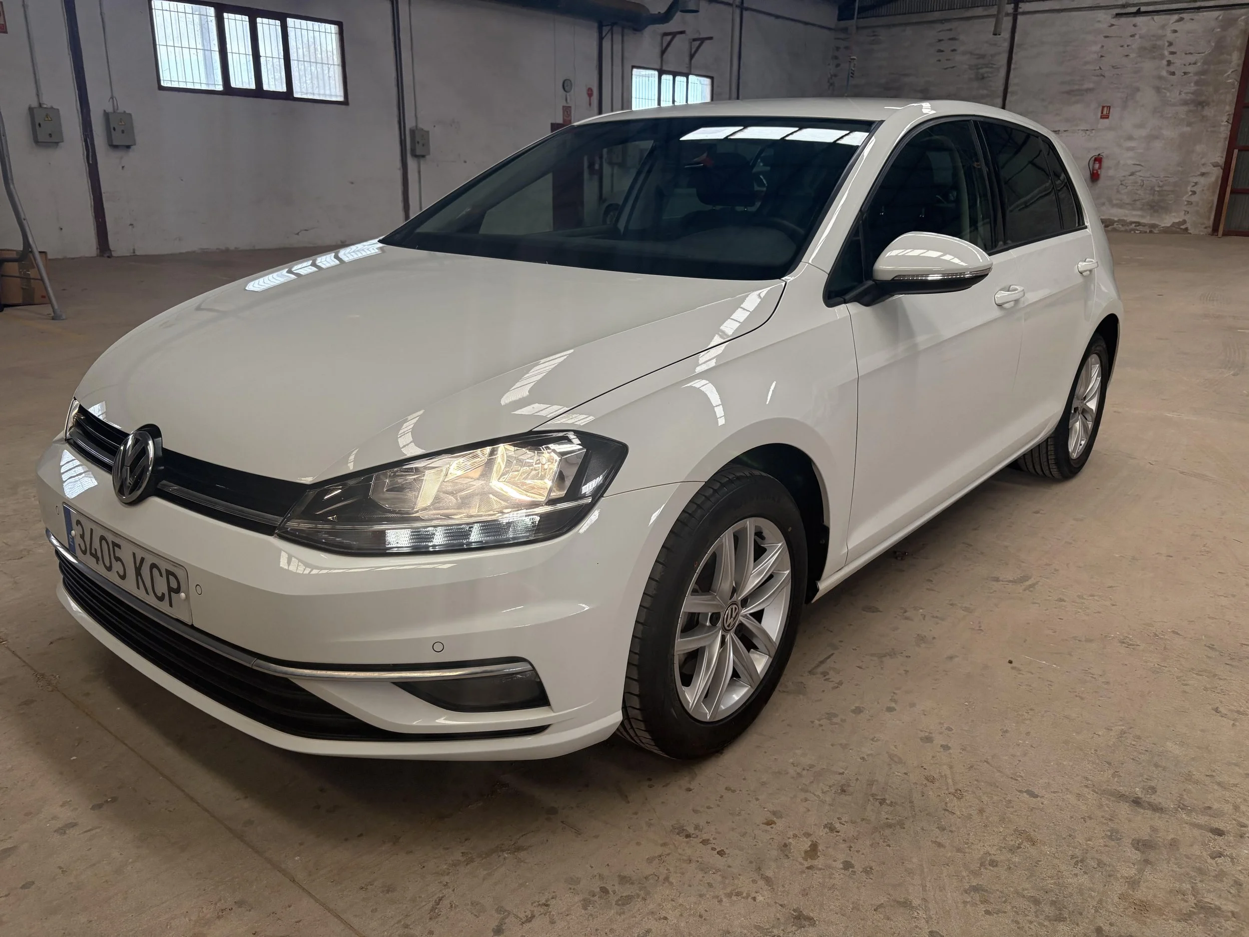 A white Volkswagen hatchback car FOR RENT rent a car vehicle hire