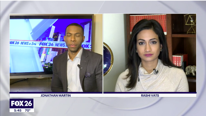 News broadcast screenshot on FOX 26 showing Jonathan Martin on the left and Rashi Vats on the right, with a news ticker at the bottom.