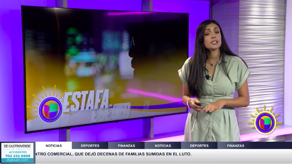 Television news studio with a woman standing in front of a large screen displaying the logo of Estafa News, purple and yellow lighting accents, and a news ticker at the bottom.