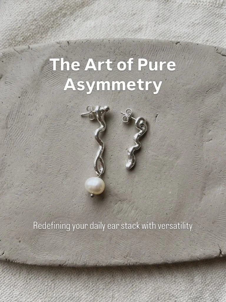 Discover how Drop of Mar&eacute;e redefines your daily ear stack with versatility. Handcrafted in silver earrings with fluid wavy features and a single pearl. Designed to be worn on the same ear for an asymmetric statement or paired for a balanced, e