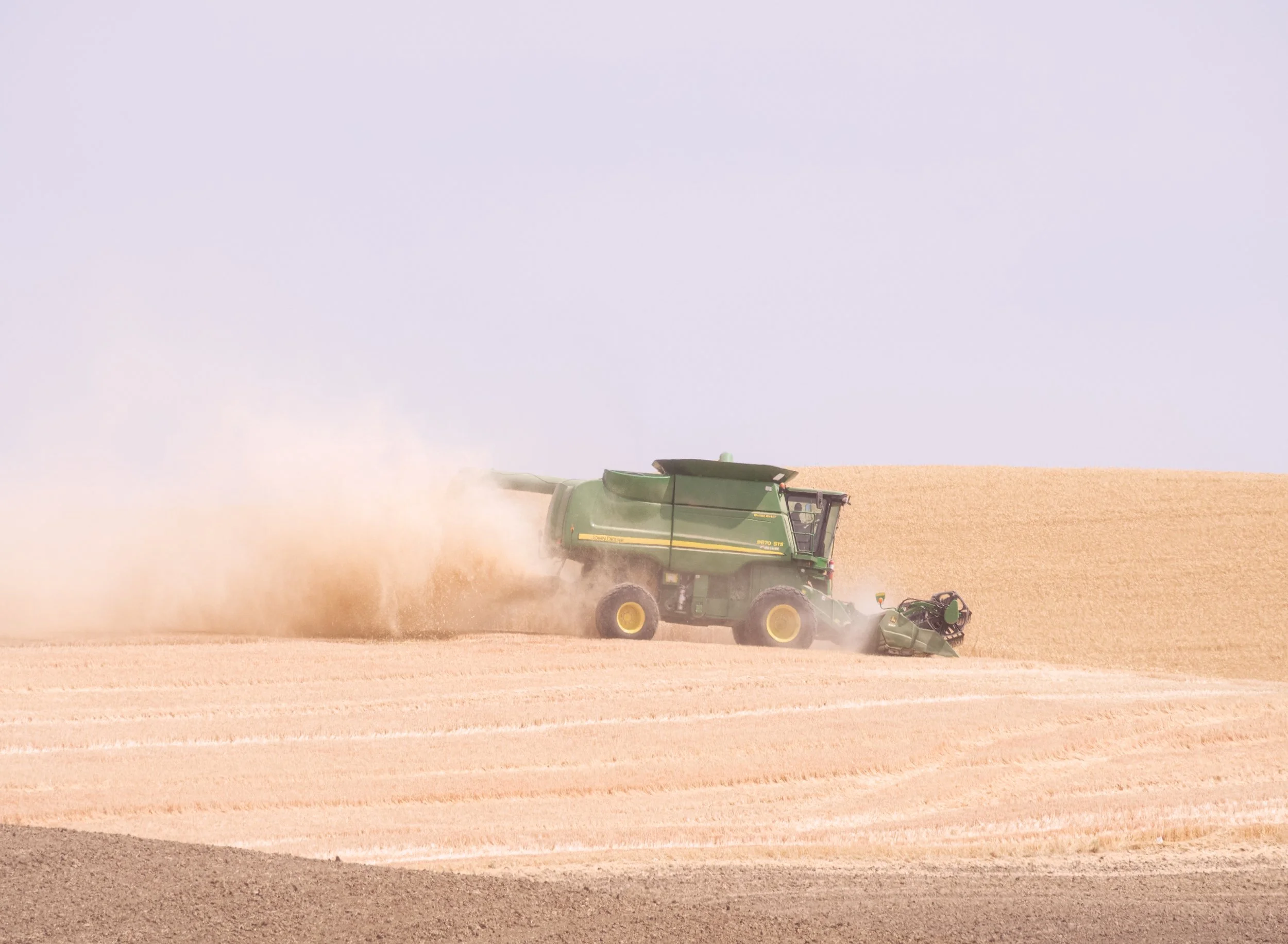 wheat-harvest-tractor-along-us-195-dust-palouse-hills-columbia-plateau-palouse-region-whitman-county-washington-state-494-color-&-photo-labs-llc.jpg