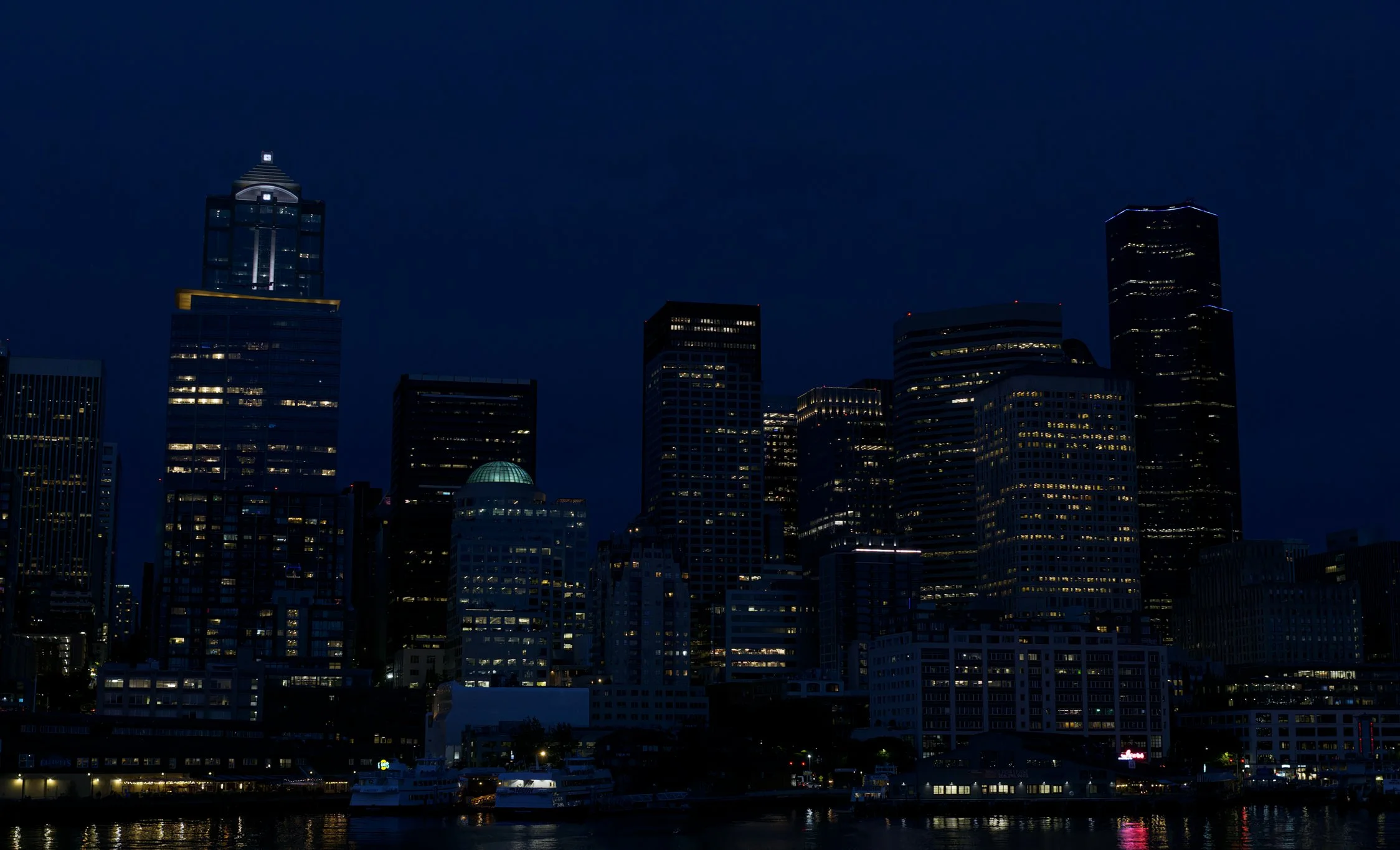 seattle-skyline-waterfront-ferry-downtown-calm-dusk-blue-hour-skyscrapers-tall-buildings-lights-the-city-central-puget-puget-sound-lowlands-king-county-494-color-and-photo-labs-llc.jpg