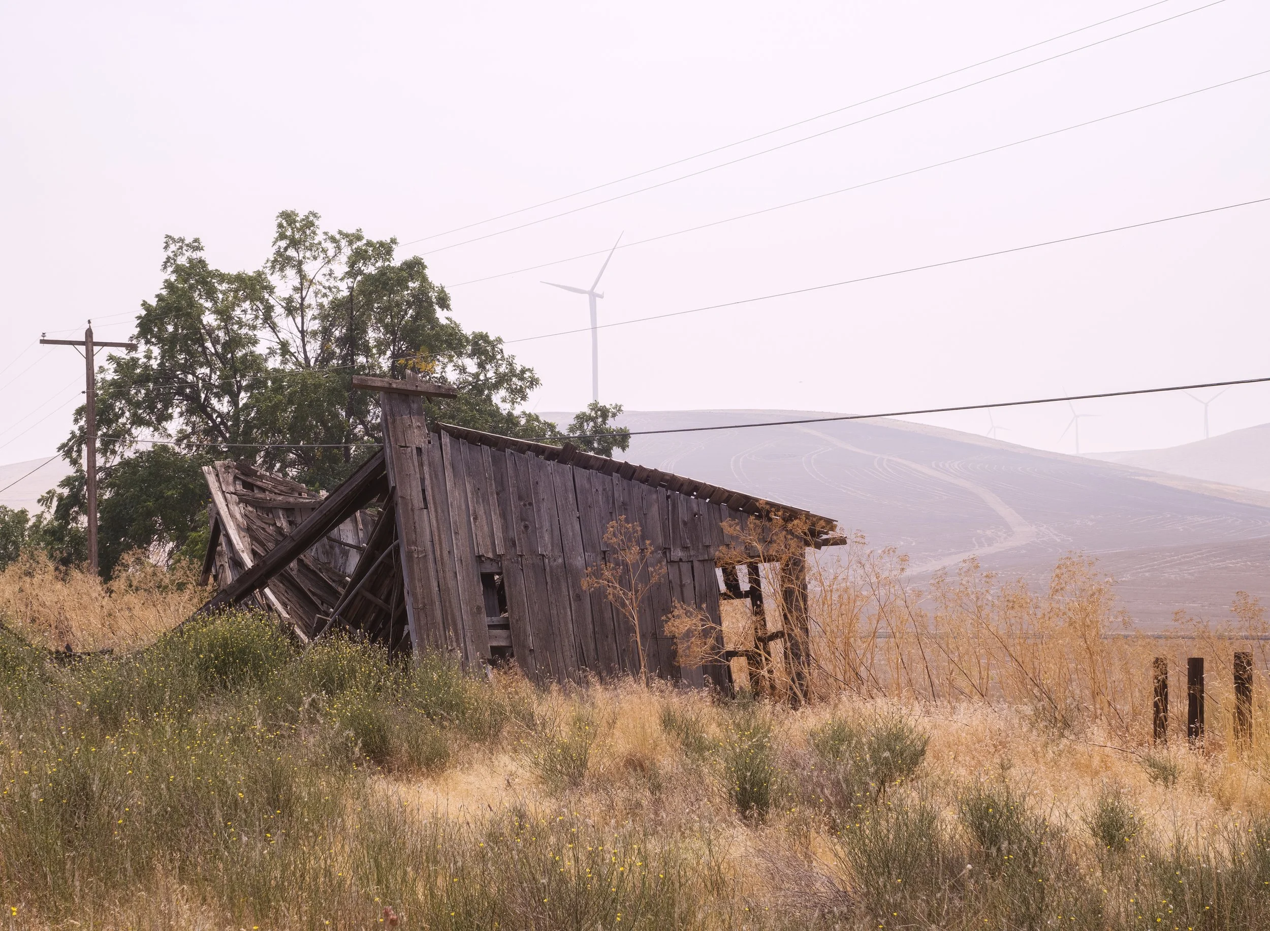 abandoned-structure-earth-toned-colors-wind-turbines-us-12-rural-country-dissected-loess-uplands-columbia-plateau-palouse-region-garfield-County-washington-state-494-color-&-photo-labs-llc.jpg