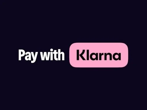 Text on a black background that reads 'Pay with Klarna' with 'Klarna' inside a pink rounded rectangle.