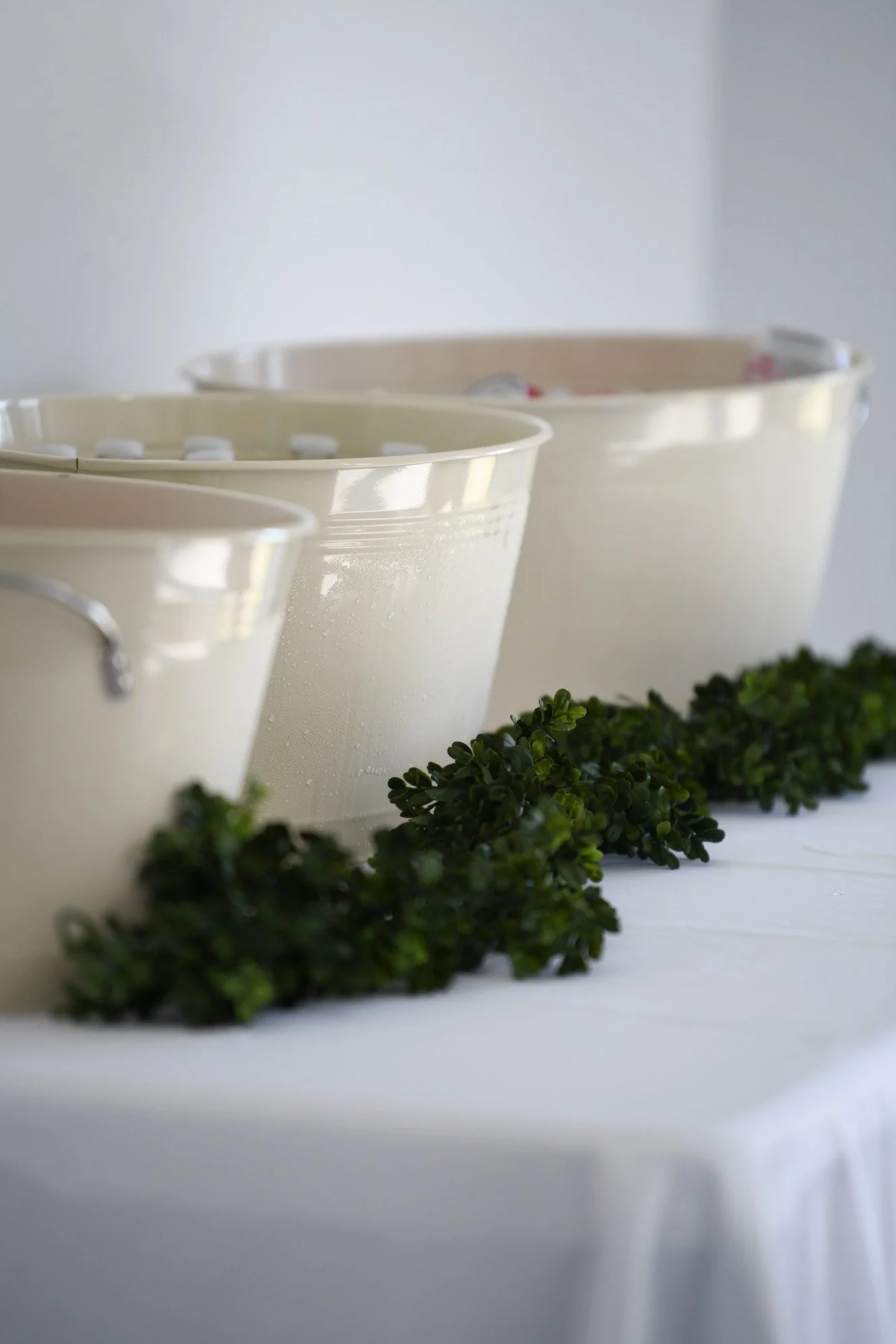 Wedding table decor with greenery and Southern charm details.